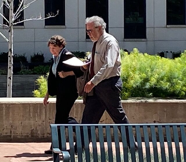 Vincent Finizio walks to the Alfred A. Arraj Federal Courthouse with his wife, Aug. 21,2023, before making a victim's impact statement. He is the older brother of murder victim Bianca Rudolph. (Carol McKinley)