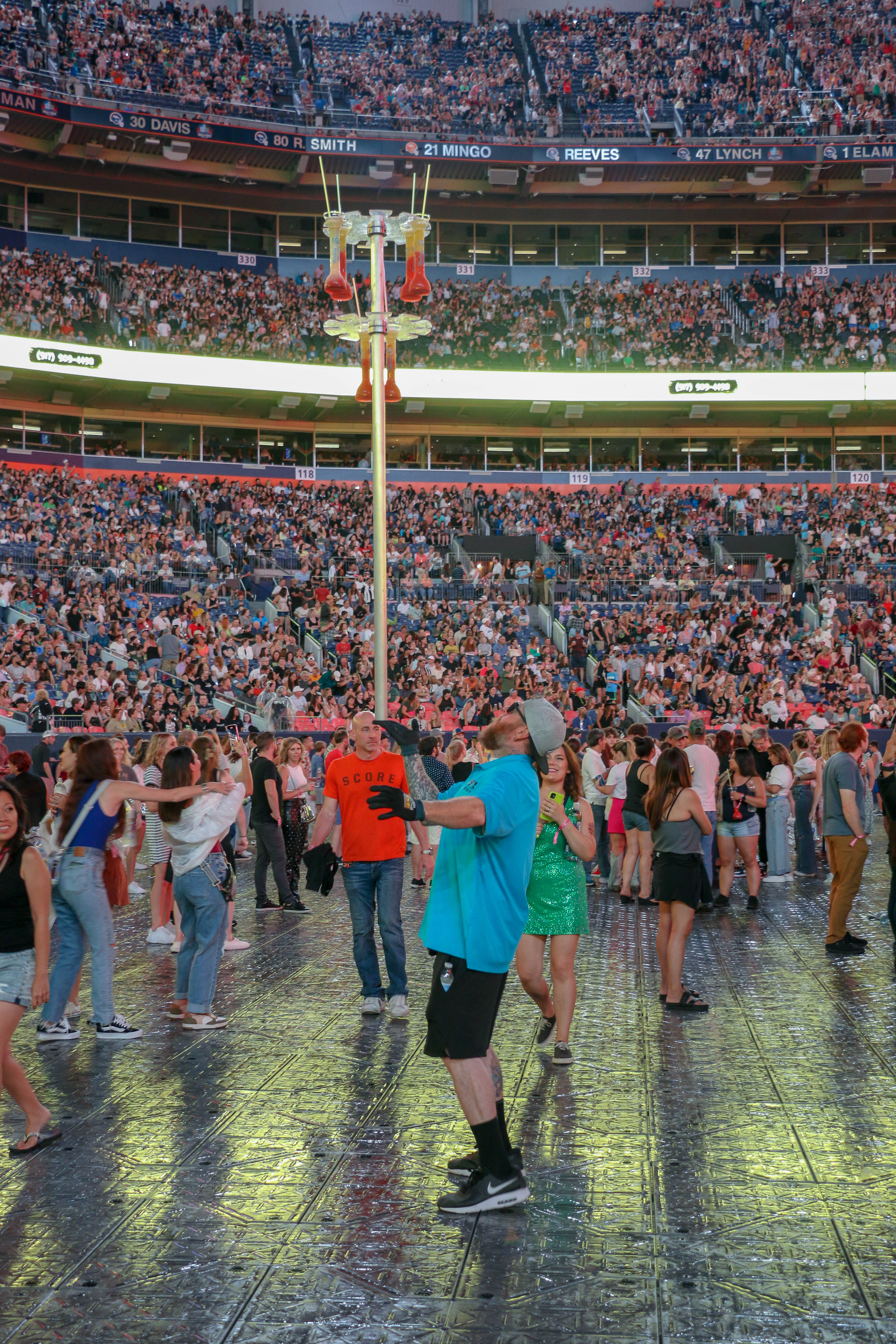A concessionaire who took full advantage of the three hour-delay at the Ed Sheeran concert in Denver on Aug. 19, 2023. (JOHN MOORE, Denver Gazette)