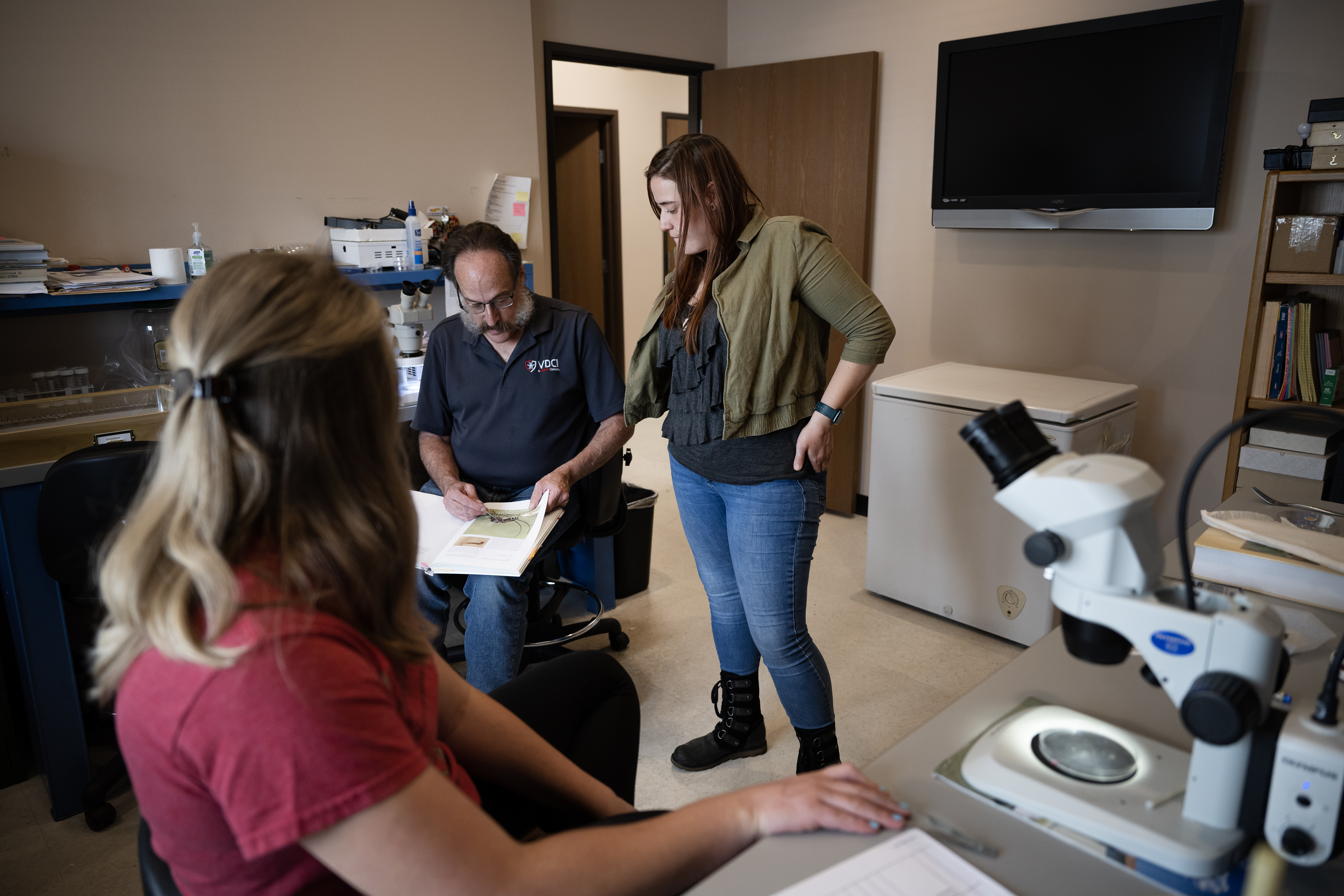 Surveillance manager Anna Wanek, right, looks on as chief entomologist Michael “Doc” Weissmann, center, confirms that laboratory manager Kelsey Renfro, left, found a Culex pilosus mosquito in a sample she’s sorting from Florida, at Vector Disease Control International on Thursday, Aug. 10, 2023, in Broomfield. (Timothy Hurst/Denver Gazette) (TimHursttim.hurst@gazette.comhttps://secure.gravatar.com/avatar/aca82bd62b4ee425c598527cd6faa1b1?d=mm&r=g)