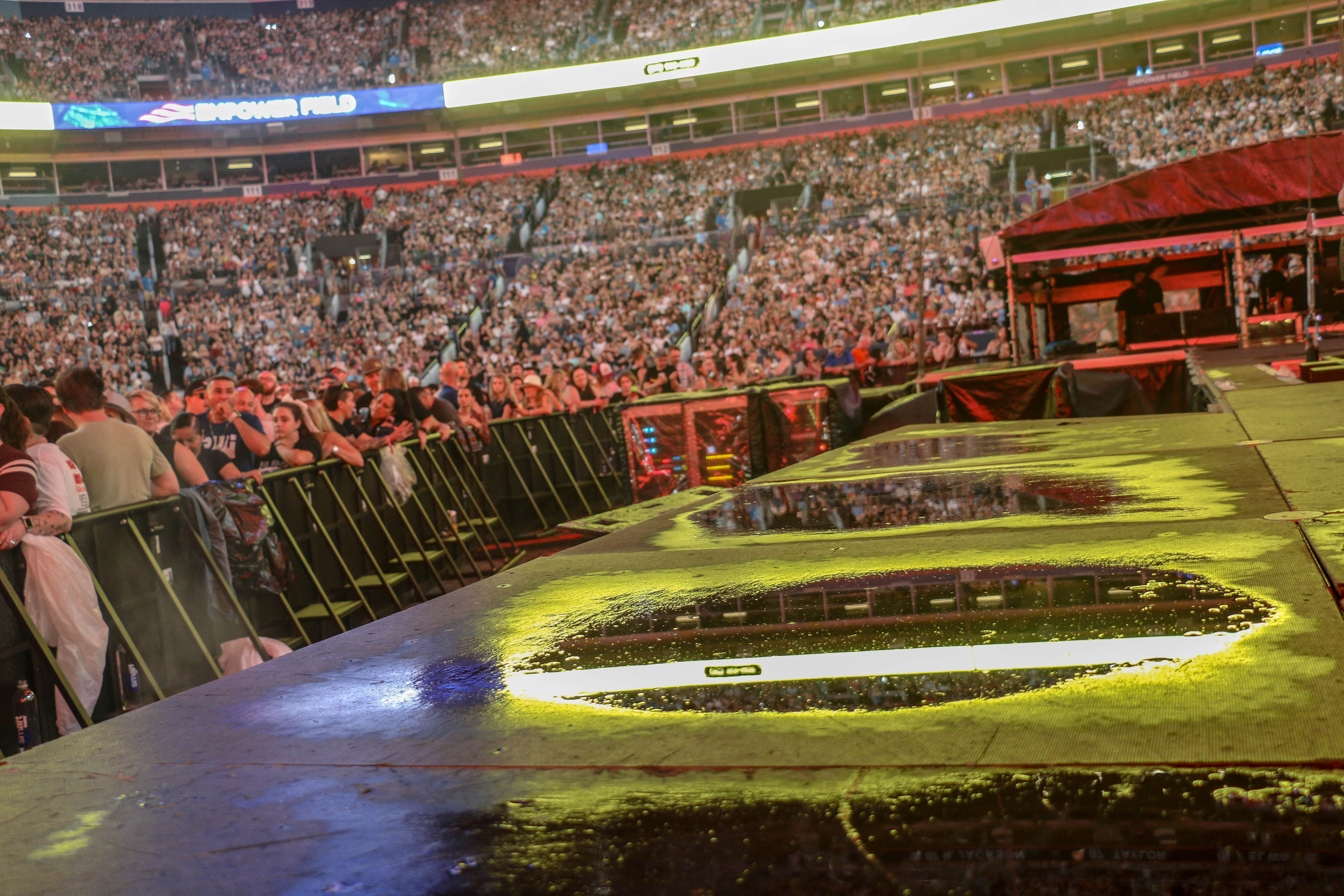 The set collected puddles during the three hours of intermittent rain while the Ed Sheeran concert was being delayed at Empower Field at Mile High Stadium in Denver on Aug. 19, 2023. (JOHN MOORE, Denver Gazette)