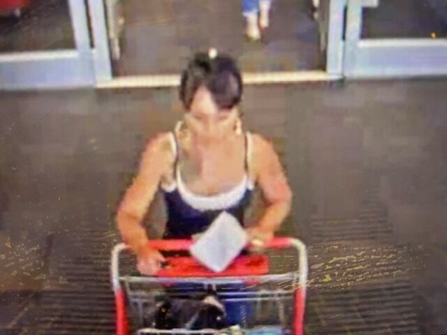 Armed robbery suspect Shawn Colby leaves a Target store with a shopping cart full of merchandise Aug. 17, 2021, according to a complaint filed by Rathod Mohamedbhai LLC. She was later arrested for the crime. (Courtesy of Rathod Mohamedbhai LLC)