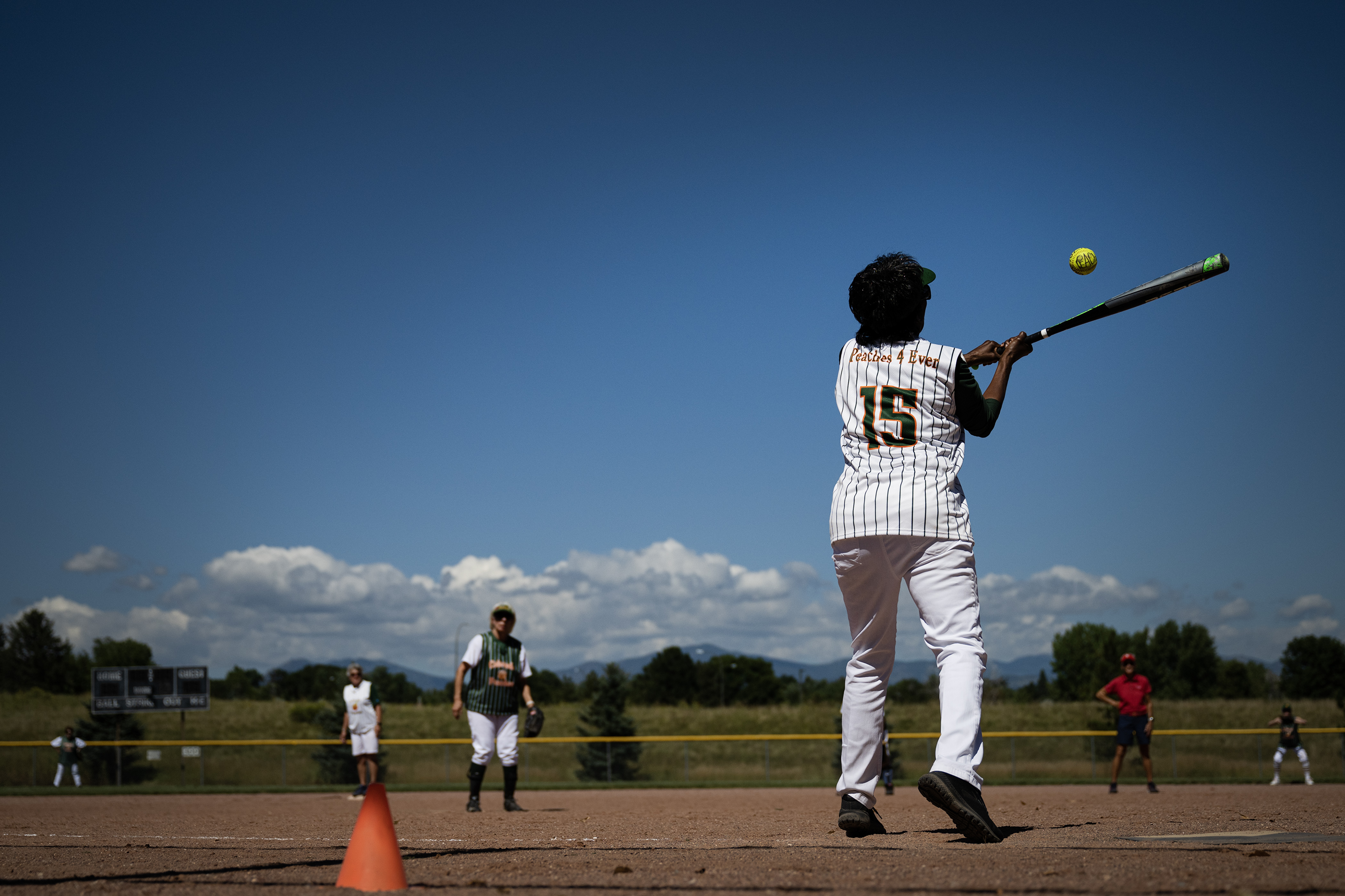 Colorado Peaches Schnapps captain Laura Clemons makes contact on a ball during a game against the Pies at the Second Annual Gail Klock Memorial Peach Bowl on Tuesday, Aug. 29, 2023, at Addenbrooke Park in Lakewood, Colo. (Timothy Hurst/Denver Gazette) (TimHursttim.hurst@gazette.comhttps://secure.gravatar.com/avatar/aca82bd62b4ee425c598527cd6faa1b1?d=mm&r=g)