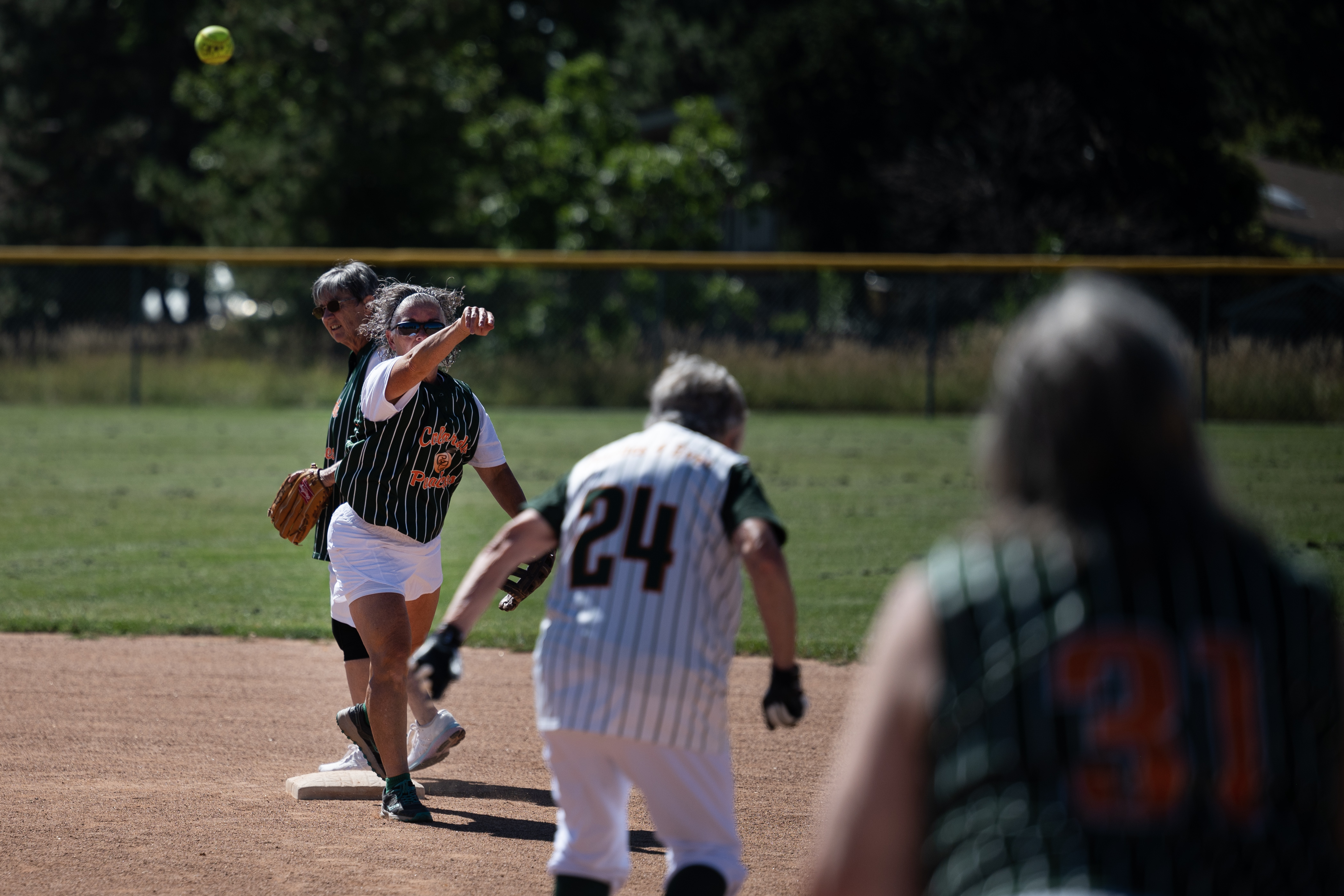 Colorado Peaches Tarts shortstop Marie Kielar (43) turns two after forcing out Turnovers runner Barbara “Mom” Johnson during the Second Annual Gail Klock Memorial Peach Bowl on Tuesday, Aug. 29, 2023, at Addenbrooke Park in Lakewood, Colo. (Timothy Hurst/Denver Gazette) (TimHursttim.hurst@gazette.comhttps://secure.gravatar.com/avatar/aca82bd62b4ee425c598527cd6faa1b1?d=mm&r=g)