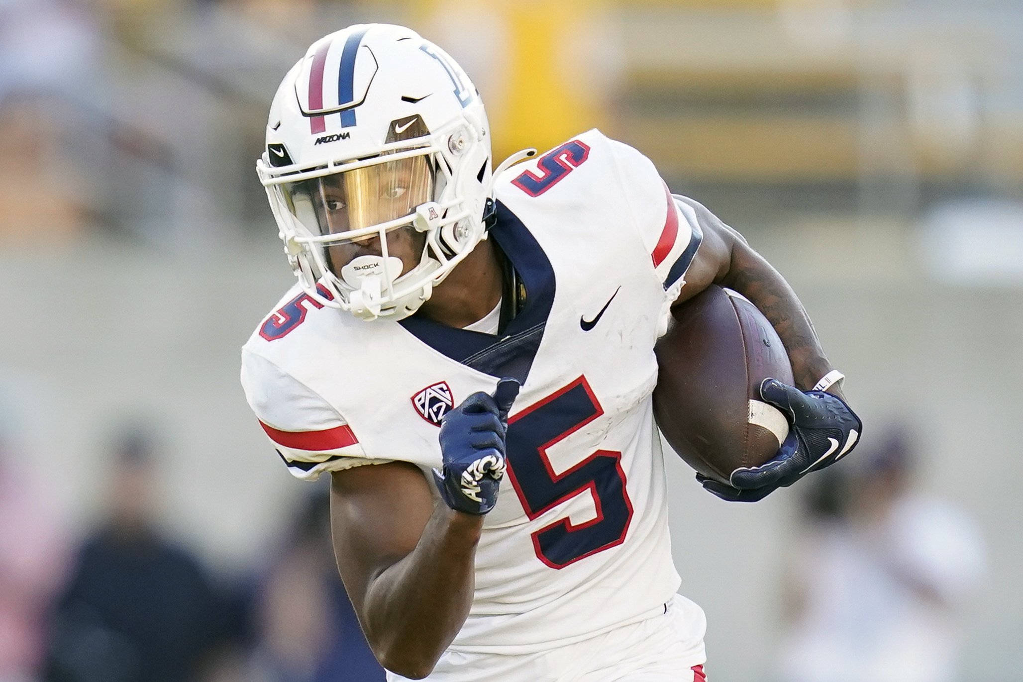 FILE - Then-Arizona wide receiver Dorian Singer (5) runs the ball after a catch against California during the second half of an NCAA college football game in Berkeley, Calif., Saturday, Sept. 24, 2022. Singer was Arizona's leading receiver last season with 66 catches for 1,105 yards before deciding to transfer to USC. (AP Photo/Godofredo A. Vásquez, File) (Godofredo A. Vásquez)