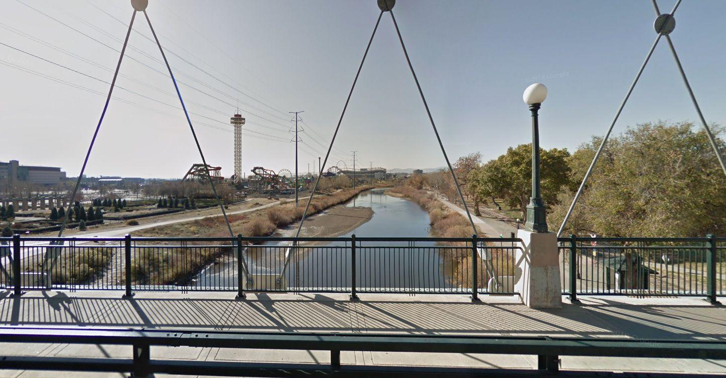 The South Platte River as seen from the Speer Boulevard bridge looking south, with Elitch Gardens amusement park and Empower Field at Mile High in the distance. (Google Maps Street View)