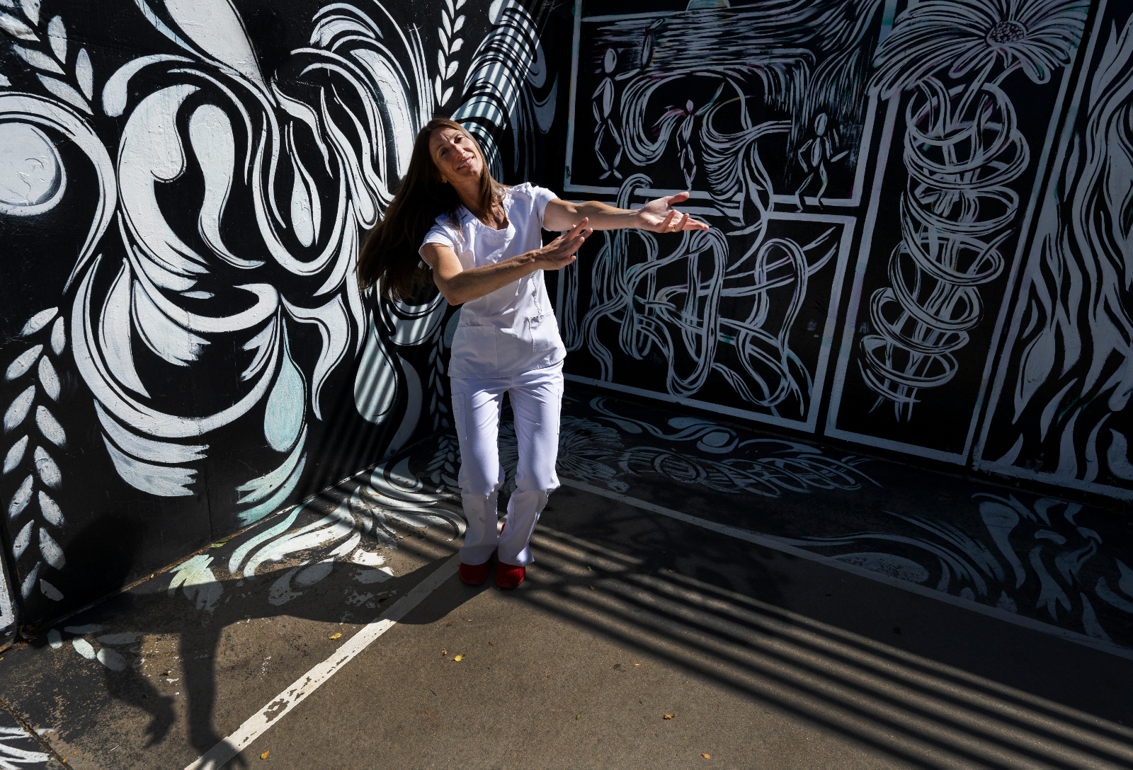Tara Rynders, photographed at Sunken Gardens Park in September 2023, has been using her dance background to help her fellow nurses since 2009. (Christian Murdock, The Denver Gazette)