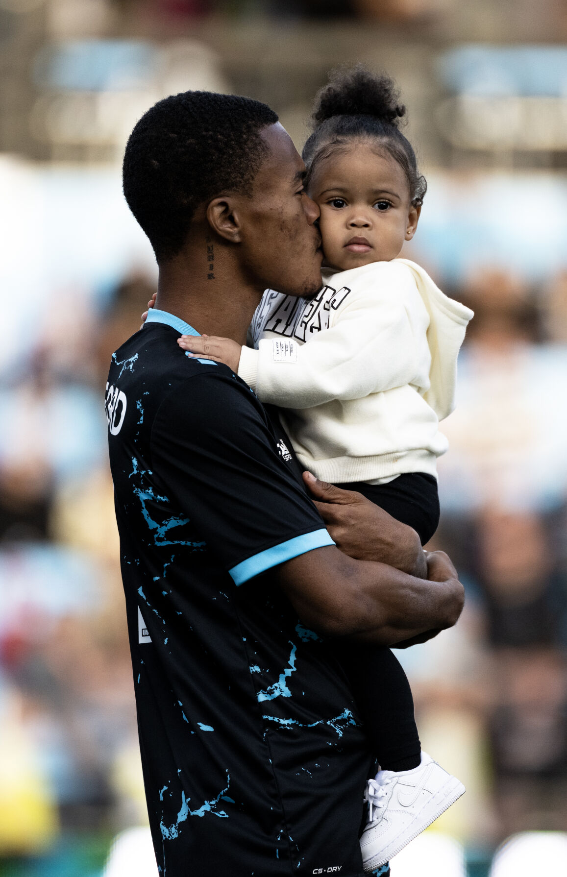 Colorado Springs Switchbacks FC forward Deshane Beckford holds his daughter during National Anthem before a soccer game at Weidner Field on Saturday, Sept. 23, 2023. (Parker Seibold, The Gazette) (Parker Seibold)