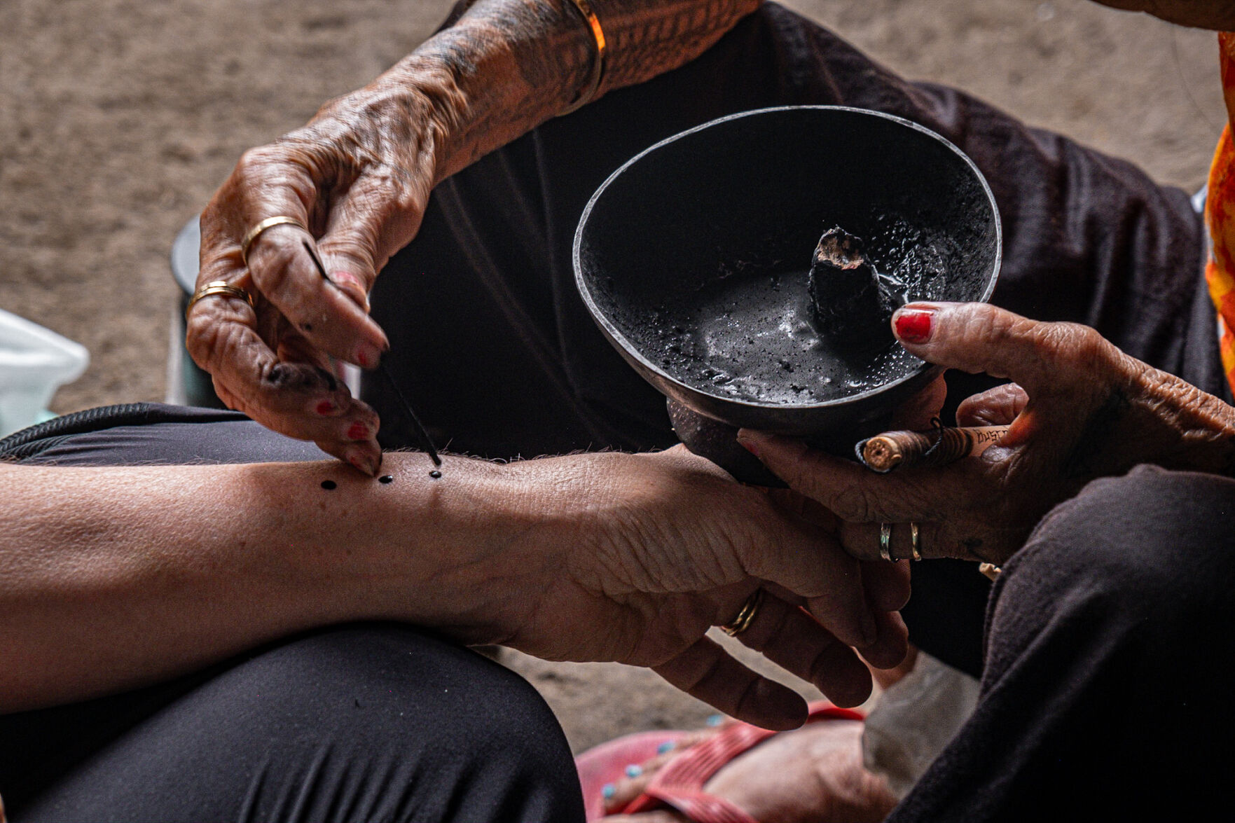 The ash-based ink Whang-Od uses. (Aria Brauchli, Special to The Gazette)