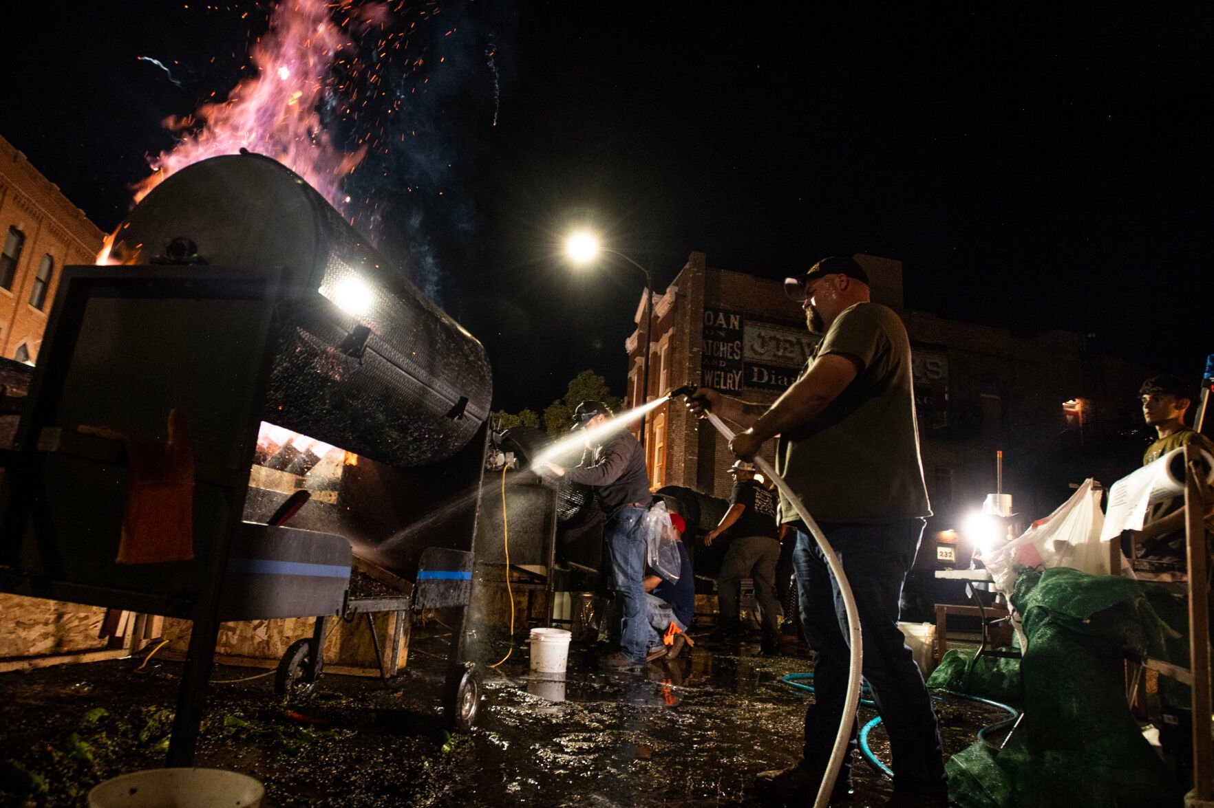 Kenny Bill sprays roasting chiles Friday on the first day of the 29th Annual Pueblo Chile and Frijoles Festival in Pueblo. The festival continues 10 a.m. to midnight Saturday and 10 a.m. to 5 p.m. Sunday.Heating Pueblo up (Parker Seibold, The Gazette)