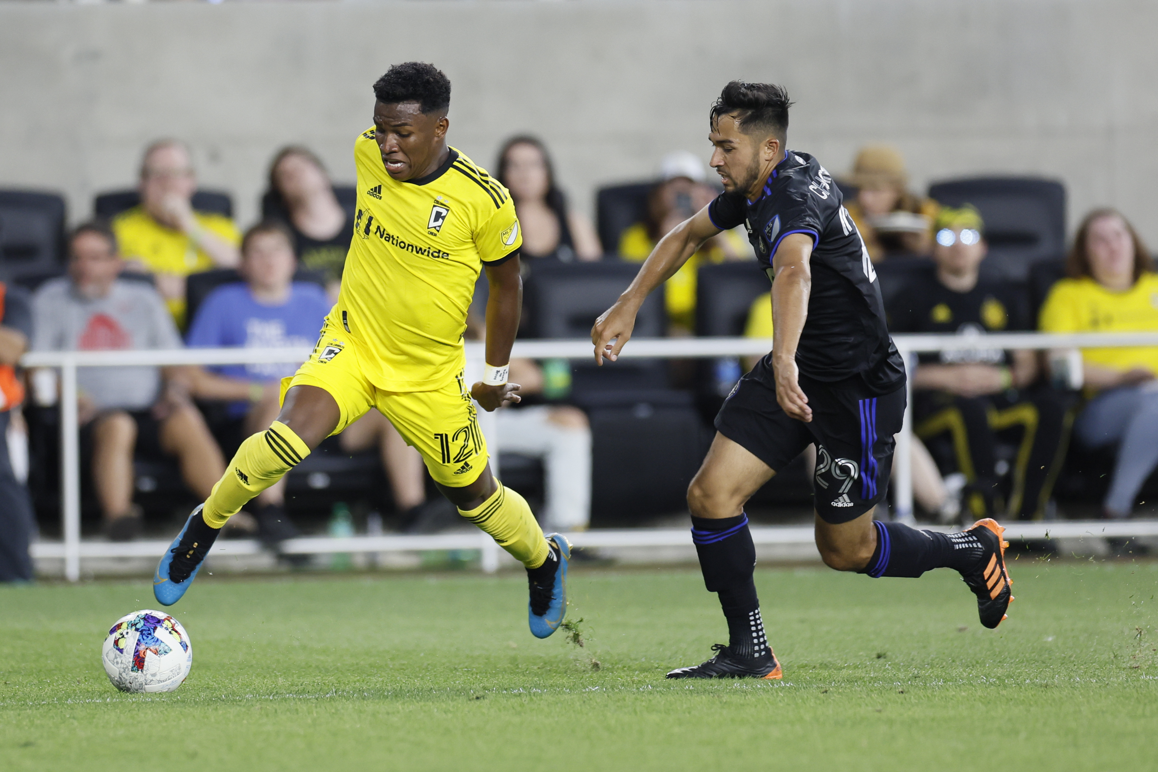 Columbus Crew's Luis Diaz, left, passes the ball past CF Montreal's Mathieu Choiniere during the second half of an MLS soccer match Wednesday, Aug. 3, 2022, in Columbus, Ohio. (AP Photo/Jay LaPrete) (Jay LaPrete)