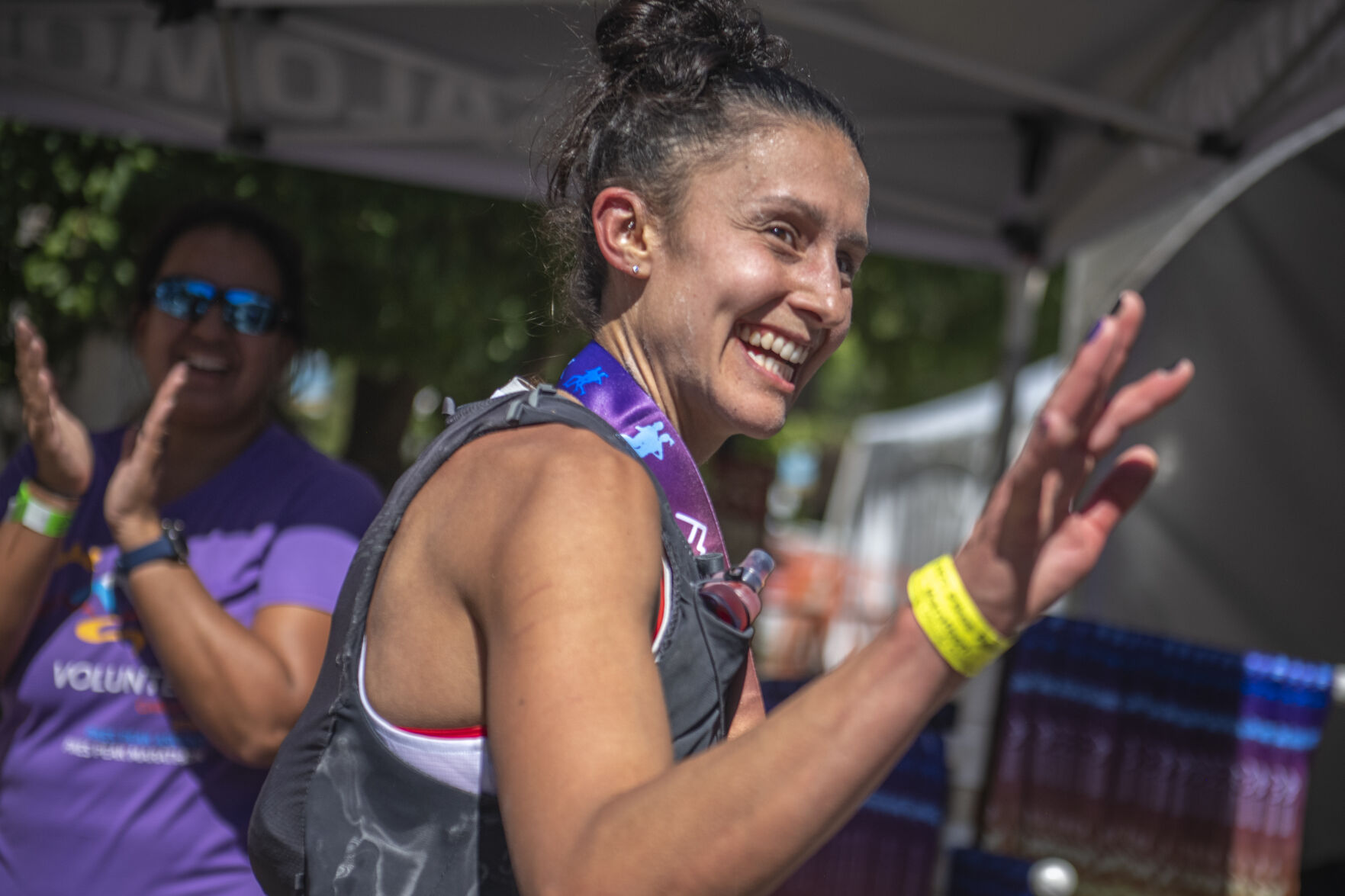 Pikes Peak Marathon 1st overall woman Kristina Mascarenas smiles and waves to friends in the cool down tent in Manitou Springs on Sunday, September 17, 2023. (Gabi Broekema)
