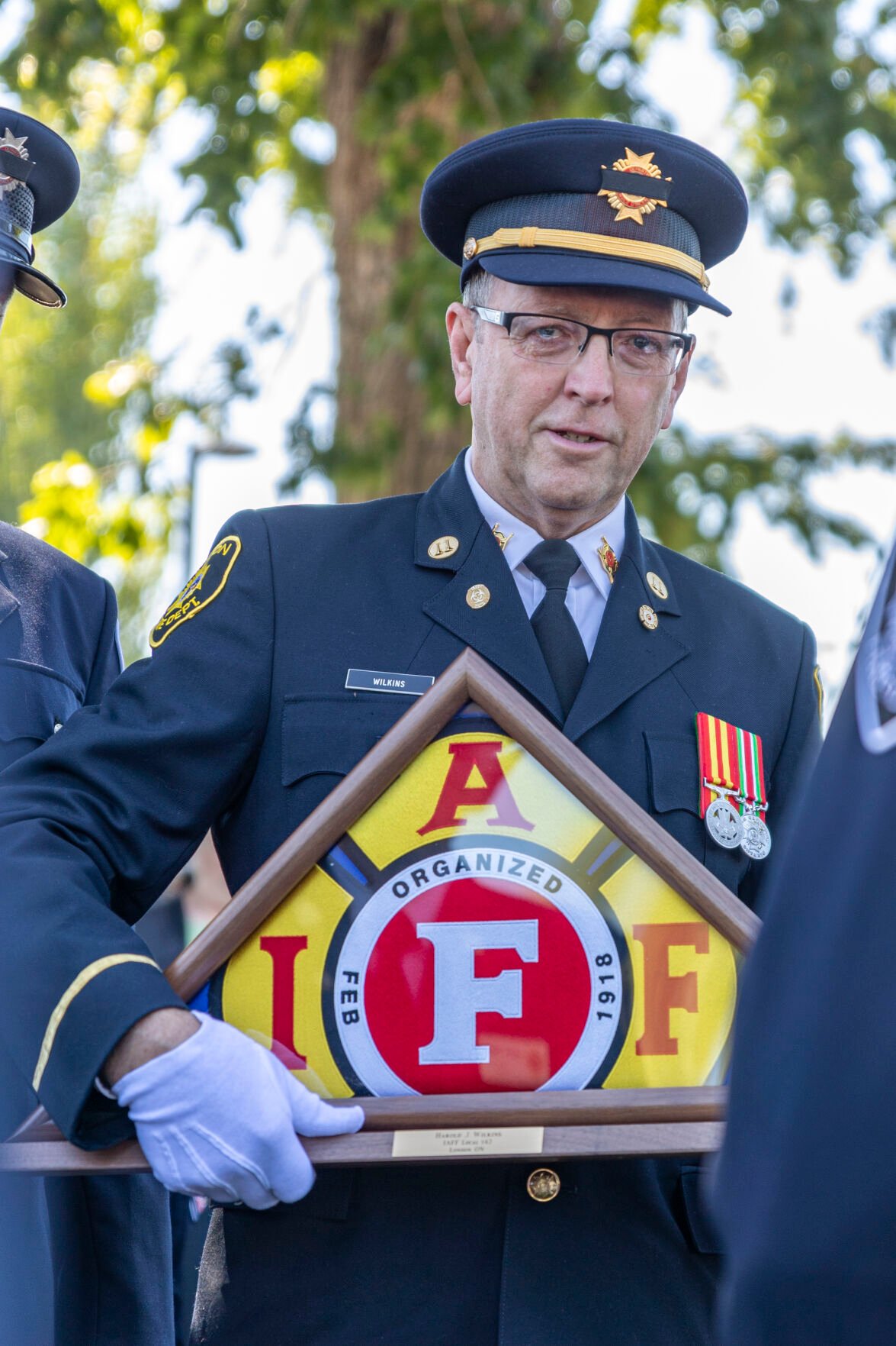 Michael Wilkins of London, Ontario, Canada, remembers his father Harold J. Wilkins during the Fallen Fire Fighter Memorial 2023 Observance in Memorial Park on Saturday, September 16, 2023. Just like his father, Michael serves with the London Fire Department. (Gabi Broekema)