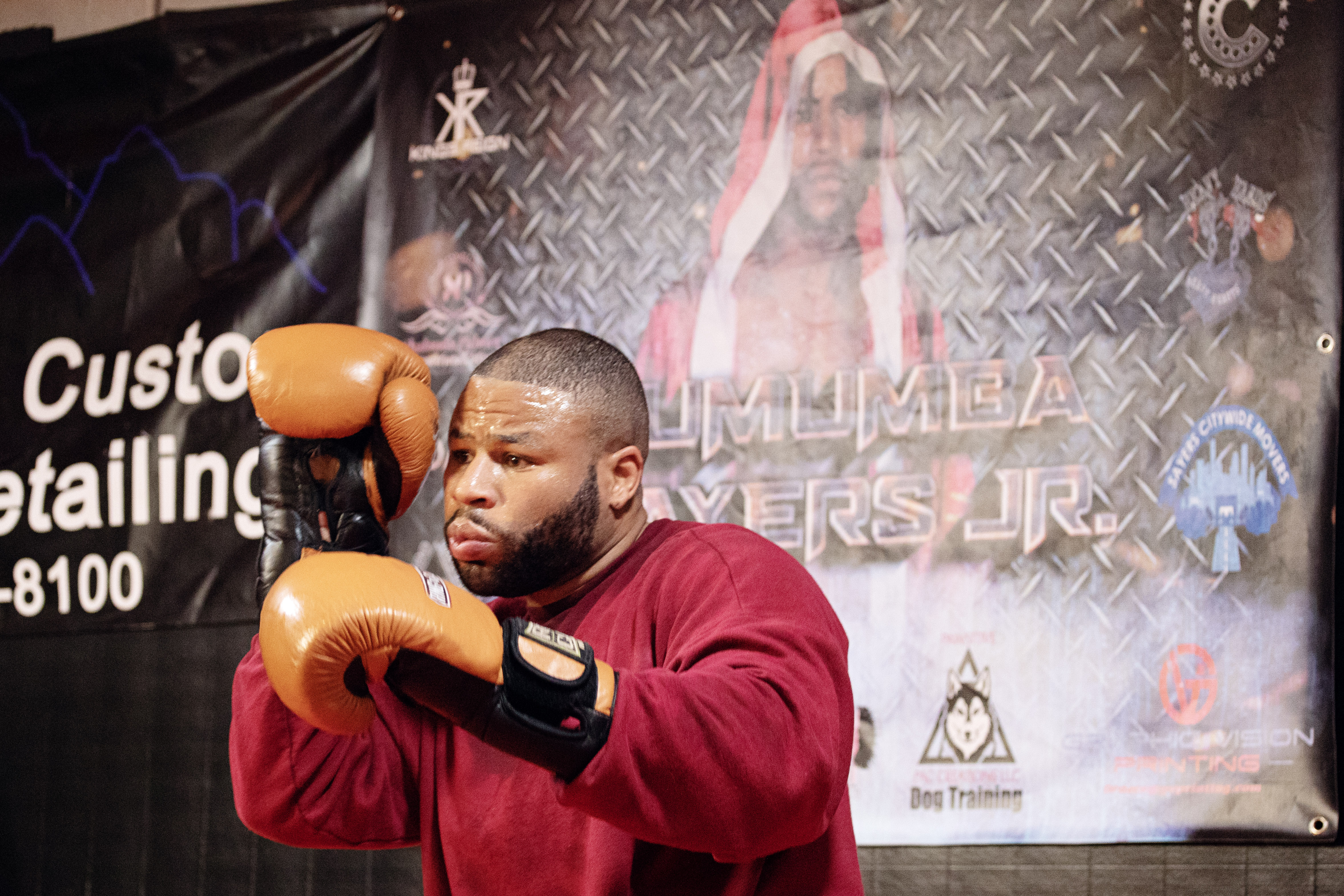 Brooklyn McCoy spars with a training partner in front of a poster of the late Lumumba Sayers Jr. at Heavy Hands Heavy Hearts gym in Aurora on Sept. 6, 2023. (TomHellauerMultimedia Producertom.hellauer@denvergazette.comhttps://denvergazette.com/content/tncms/avatars/f/9e/622/f9e6228a-3b6b-11ed-bf10-fbb71fa8e421.f54b911252c540f1d61709edc4727a39.png)