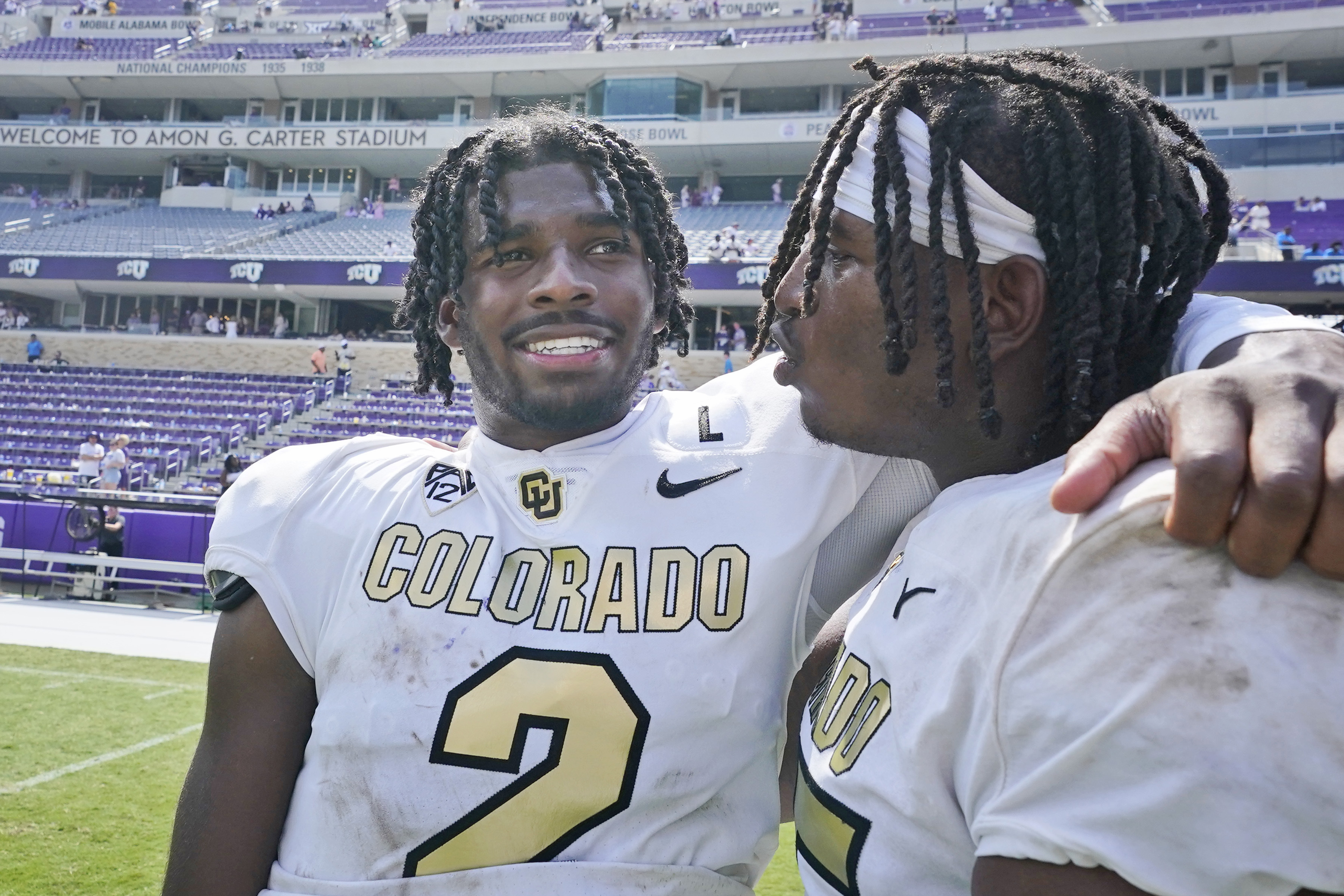 Colorado quarterback Shedeur Sanders (2) embraces a teammate after an NCAA college football game Saturday, Sept. 2, 2023, in Fort Worth, Texas. (AP Photo/LM Otero) (LM Otero)
