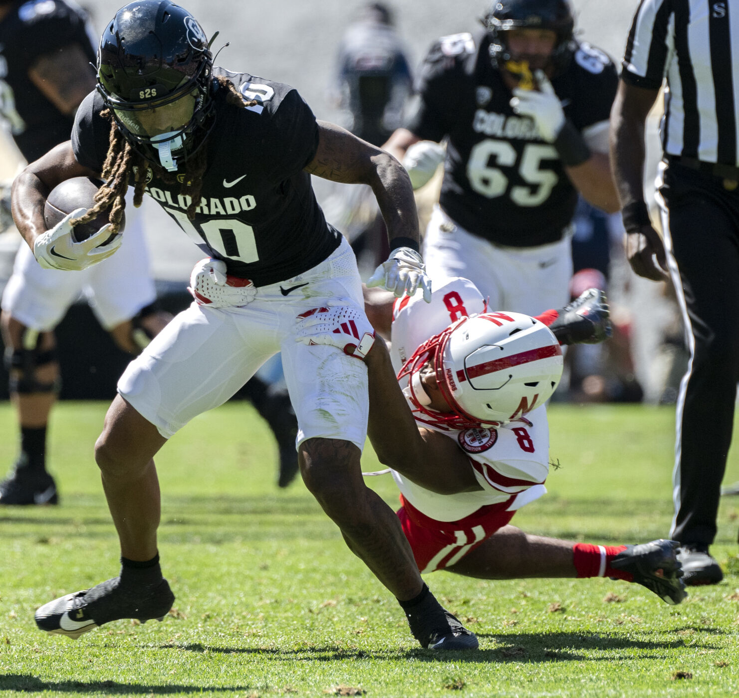 Colorado Buffaloes wide receiver Xavier Weaver (10) runs past Nebraska defensive back DeShon Singleton during the first half Saturday, Sept. 9, 2023, at Folsom Field in Boulder, Colo. (The Gazette, Christian Murdock) (Christian Murdock/The Gazette)