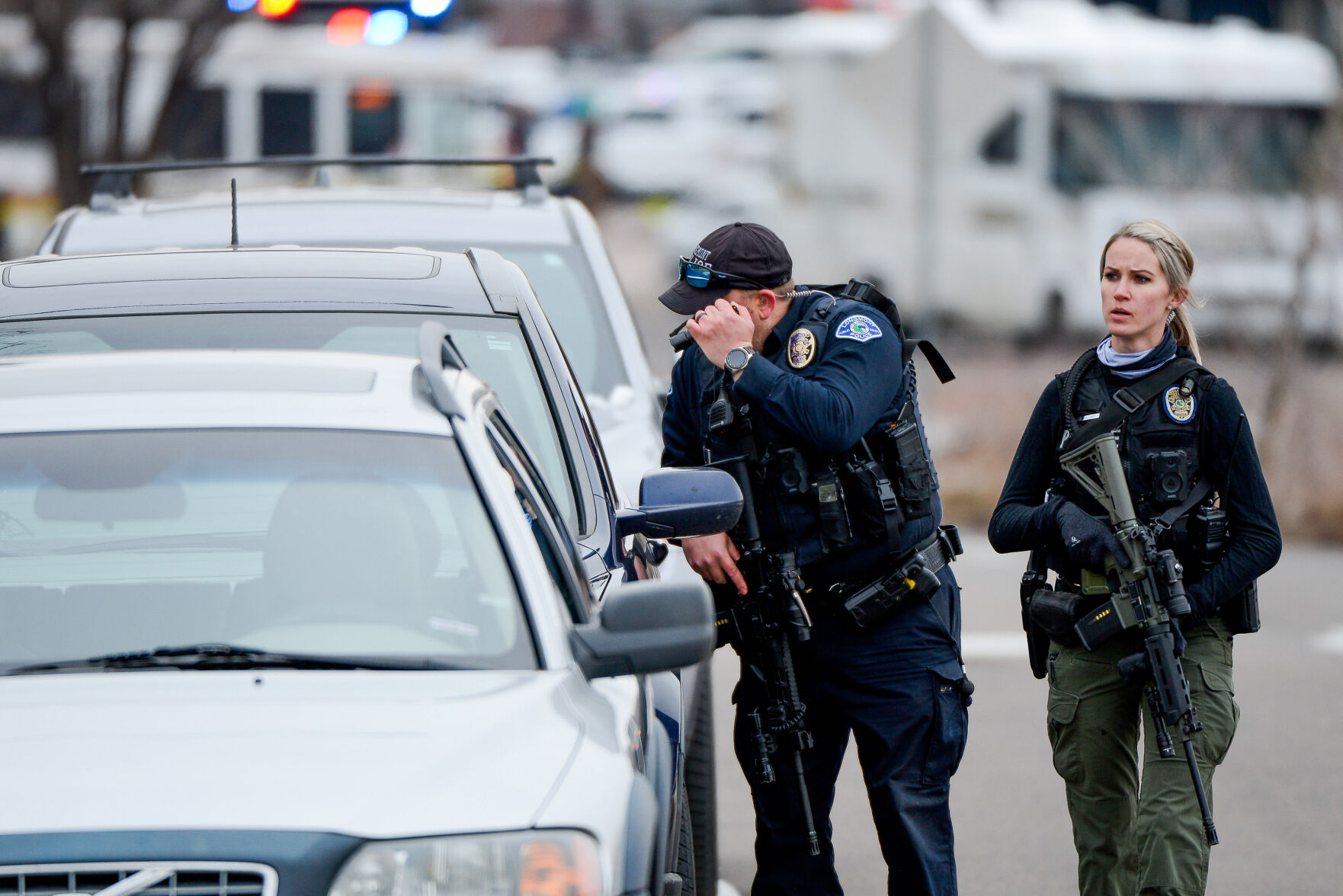 Police officers check cars as they respond to a shooting in Boulder. (Michael Ciaglo, Special to The Denver Gazette)