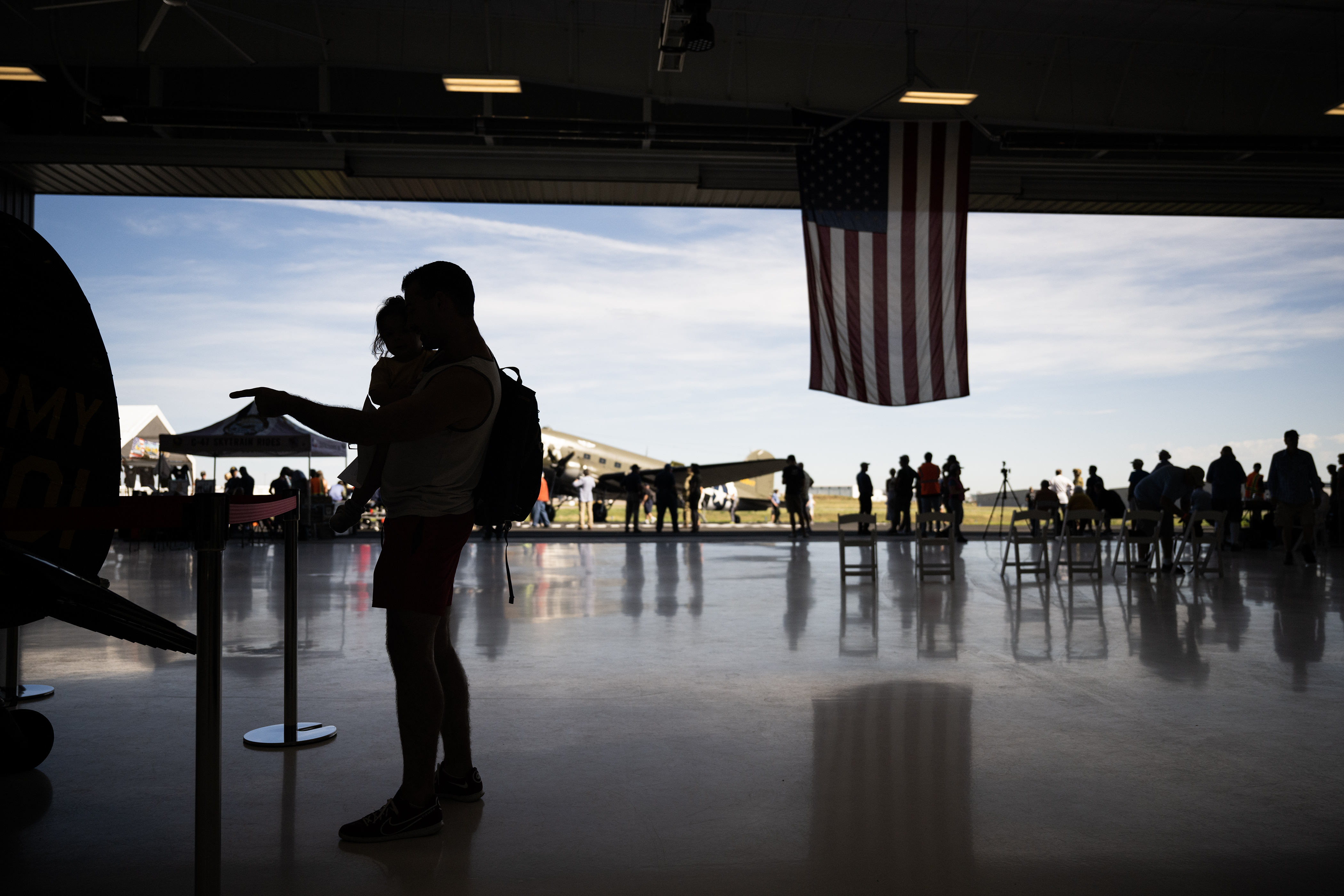 Kevin Christiansen and his one-year-old daughter Reagan check out a 1959 Cesna L-19 Birddog on display in the hangar on Friday, Sept. 1, 2023, at Wings Over the Rockies Exploration of Flight at the Centennial Airport in Centennial, Colo. (Timothy Hurst/Denver Gazette) (TimHursttim.hurst@gazette.comhttps://secure.gravatar.com/avatar/aca82bd62b4ee425c598527cd6faa1b1?d=mm&r=g)