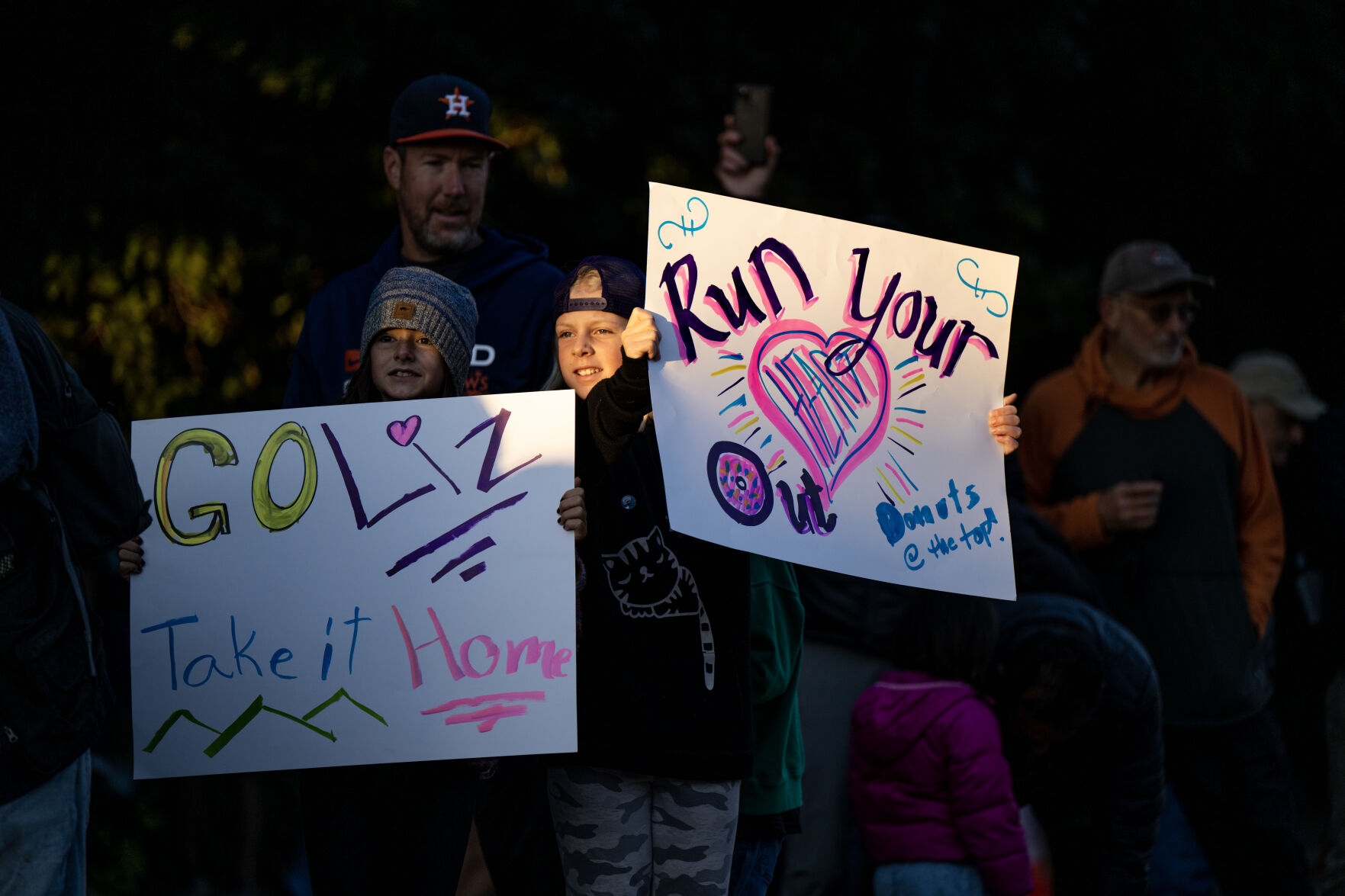 Spectators hold signs for a runner at the Pikes Peak Ascent on Saturday, Sept. 16, 2023. (Parker Seibold, The Gazette) (Parker Seibold)