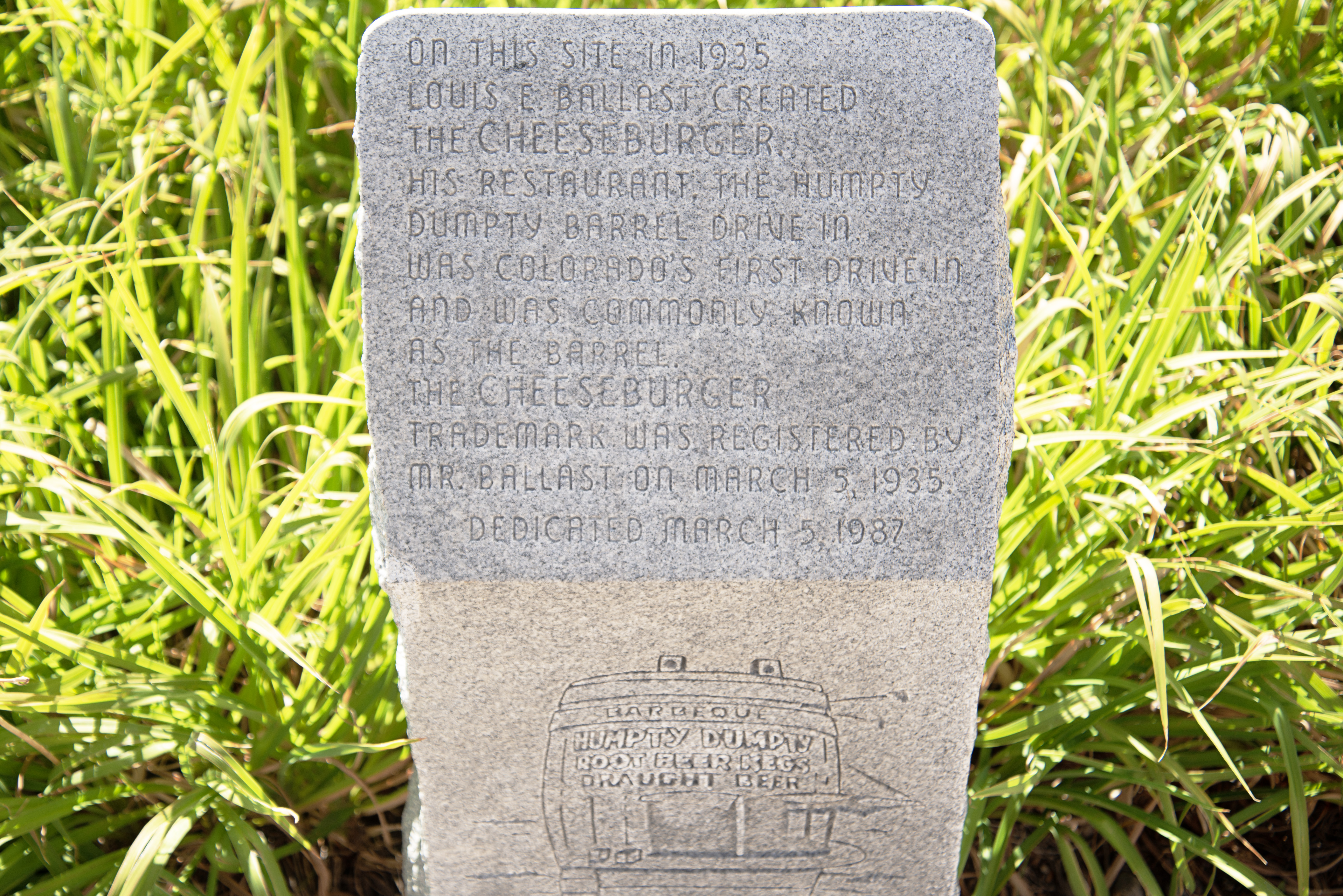 Although Louis Ballast claims to have invented the American food staple cheeseburger in 1935, similar claims have emerged with evidence of cheeseburgers from earlier dates in Kentucky and California. This marker with Ballast's claim is at Speer Boulevard and Zuni Street in Denver. (TomHellauerMultimedia Producertom.hellauer@denvergazette.comhttps://denvergazette.com/content/tncms/avatars/f/9e/622/f9e6228a-3b6b-11ed-bf10-fbb71fa8e421.f54b911252c540f1d61709edc4727a39.png)