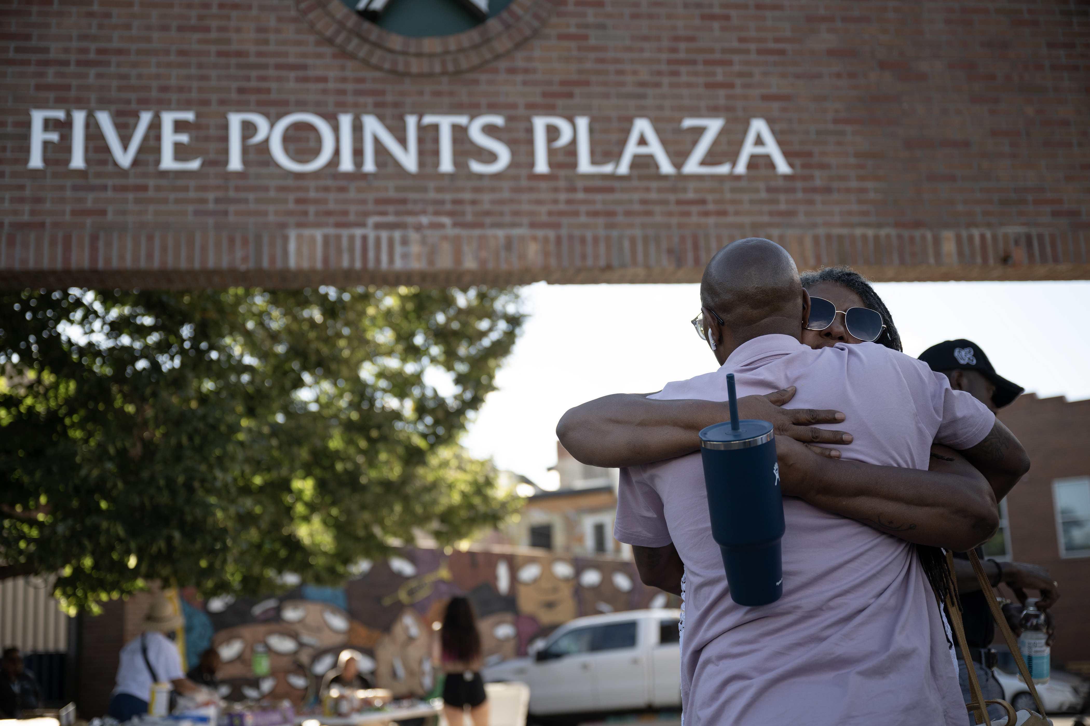 Wendy Talley, with The Latino Coalition for Community Leadership, hugs Quincy Wedgeworth, with Make a Chess Move, during a “Safe Haven Activation” in response to a shooting double-homicide on Aug. 19 as seen on Thursday, Aug. 31, 2023, at Five Points Plaza in Denver. (Timothy Hurst/Denver Gazette) (TimHursttim.hurst@gazette.comhttps://secure.gravatar.com/avatar/aca82bd62b4ee425c598527cd6faa1b1?d=mm&r=g)