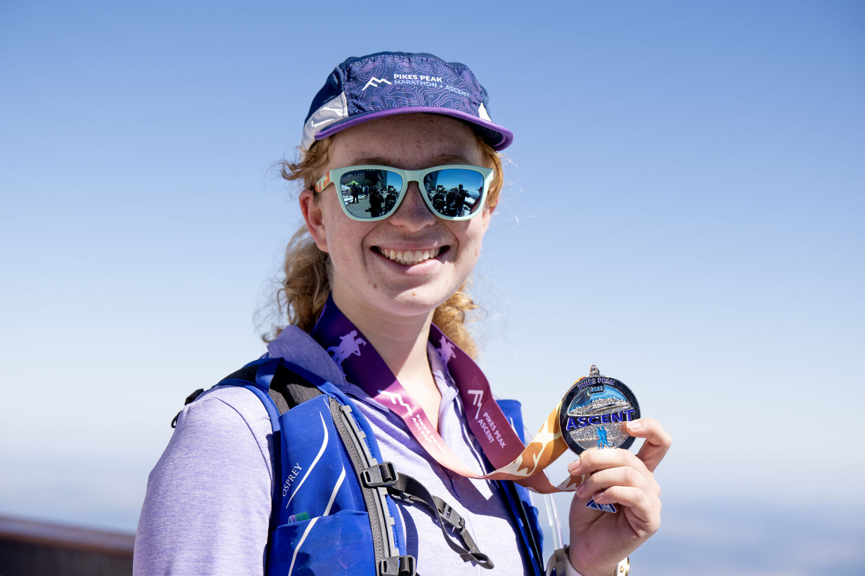 Katie Sena poses for a portrait at the summit of Pikes Peak following the Pikes Peak Ascent on Saturday, Sept. 16, 2023. At 17-years-old Sena was the youngest competitor this year. (Parker Seibold, The Gazette) (Parker Seibold)