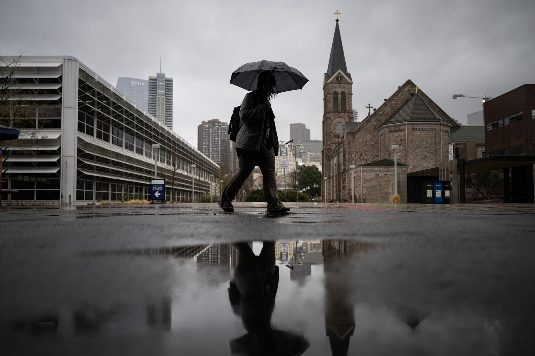 Metropolitan State University of Denver student Amber Kalafus walks to class through a rainstorm on Tuesday, April 25, 2023, on the Auraria Campus in Denver, Colo. (Timothy Hurst/Denver Gazette) (TimHursttim.hurst@gazette.comhttps://secure.gravatar.com/avatar/aca82bd62b4ee425c598527cd6faa1b1?d=mm&r=g)