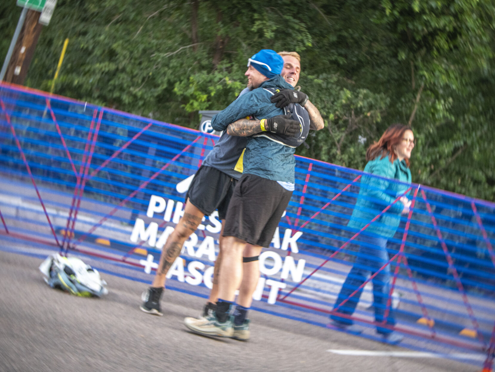 Pikes Peak Marathon finisher James Hestand hugs a friend at the start of the race in Manitou Springs on Sunday, September 17, 2023. (Gabi Broekema)