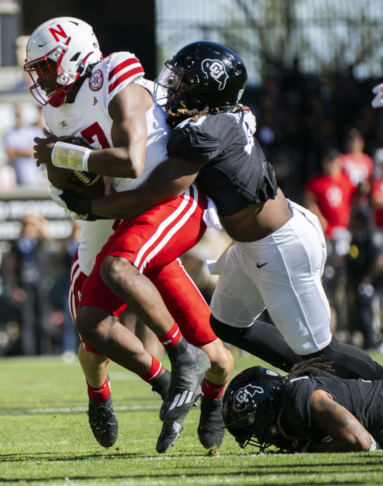Colorado Buffaloes defensive end Taijh Alston (49) sacks Nebraska Cornhuskers quarterback Jeff Sims (7) during the first half Saturday, Sept. 9, 2023, at Folsom Field in Boulder, Colo. (The Gazette, Christian Murdock) (Christian Murdock/The Gazette)