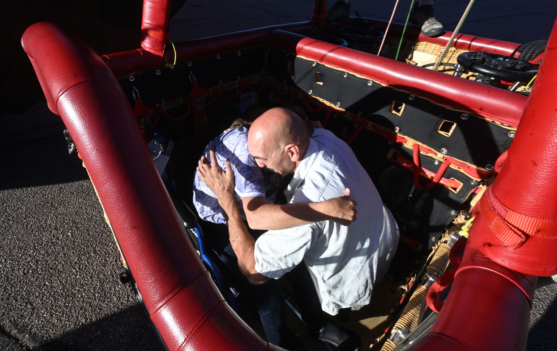 Ginger Gustafson has a big hug for her brother, Rick Gustafson after he arranged for her to fly in her wheelchair in the Colorado Springs Labor Day Lift Off on Monday, Sept. 4, 2023. (Photo by Jerilee Bennett, The Gazette)