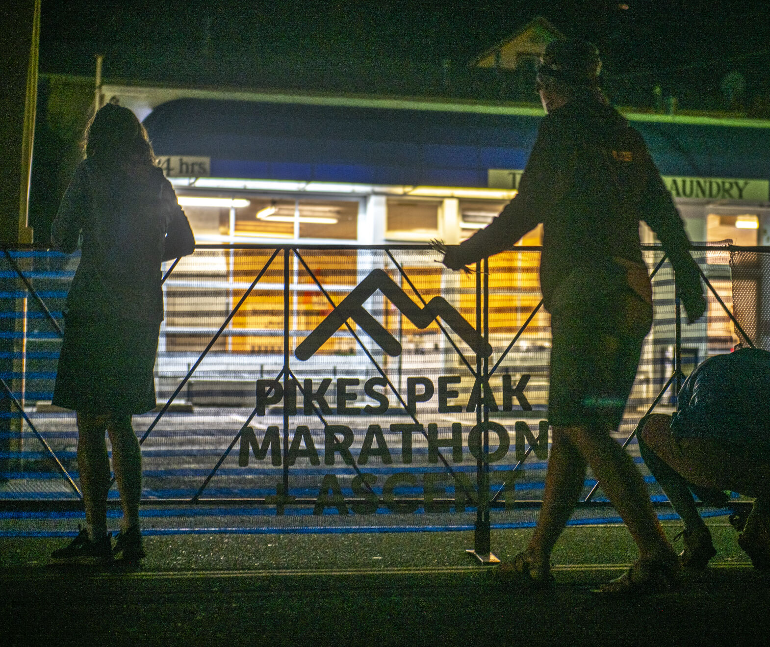The Pikes Peak Marathon operations team works together to set up the starting line for the 68th running of the Pikes Peak Marathon in Manitou Springs on Sunday, September 17, 2023. (Gabi Broekema)