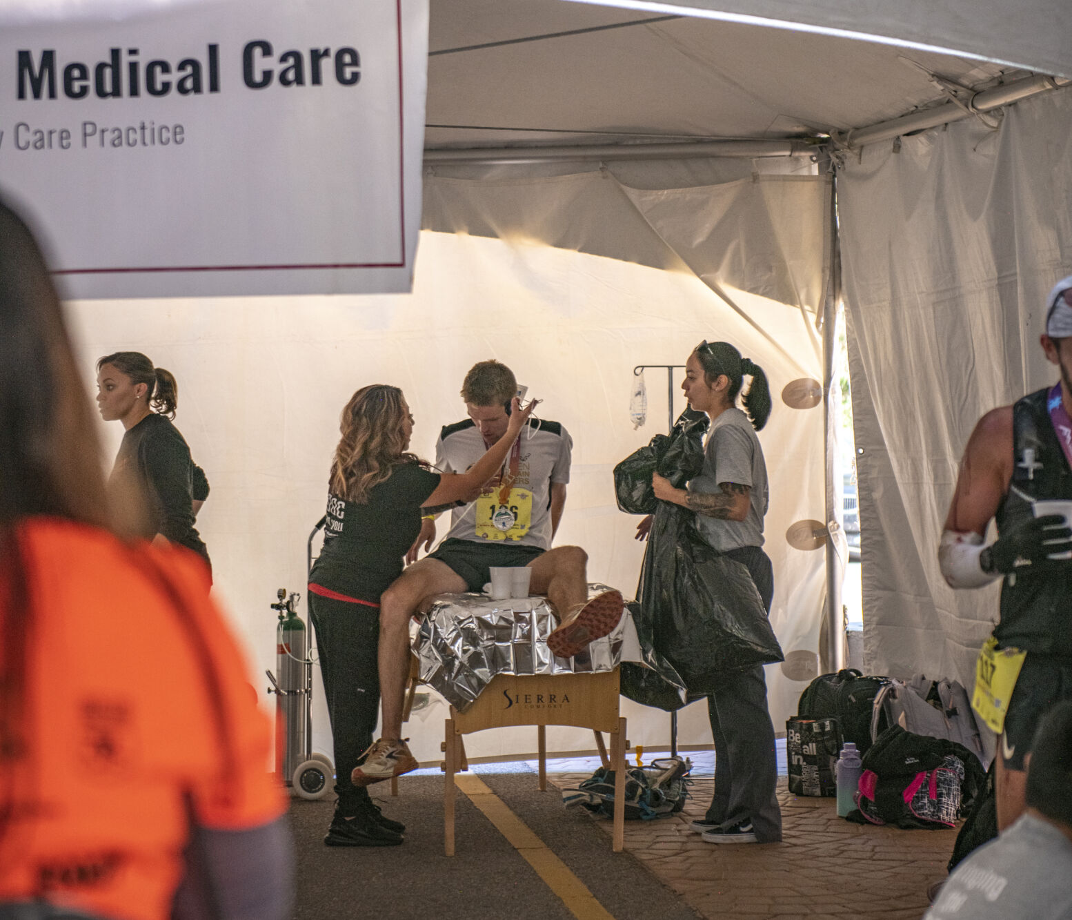 Pikes Peak Marathon 11th placer overall Sam Johnson recipes care in thew cool down tent in Manitou Springs on Sunday, September 17, 2023. (Gabi Broekema)