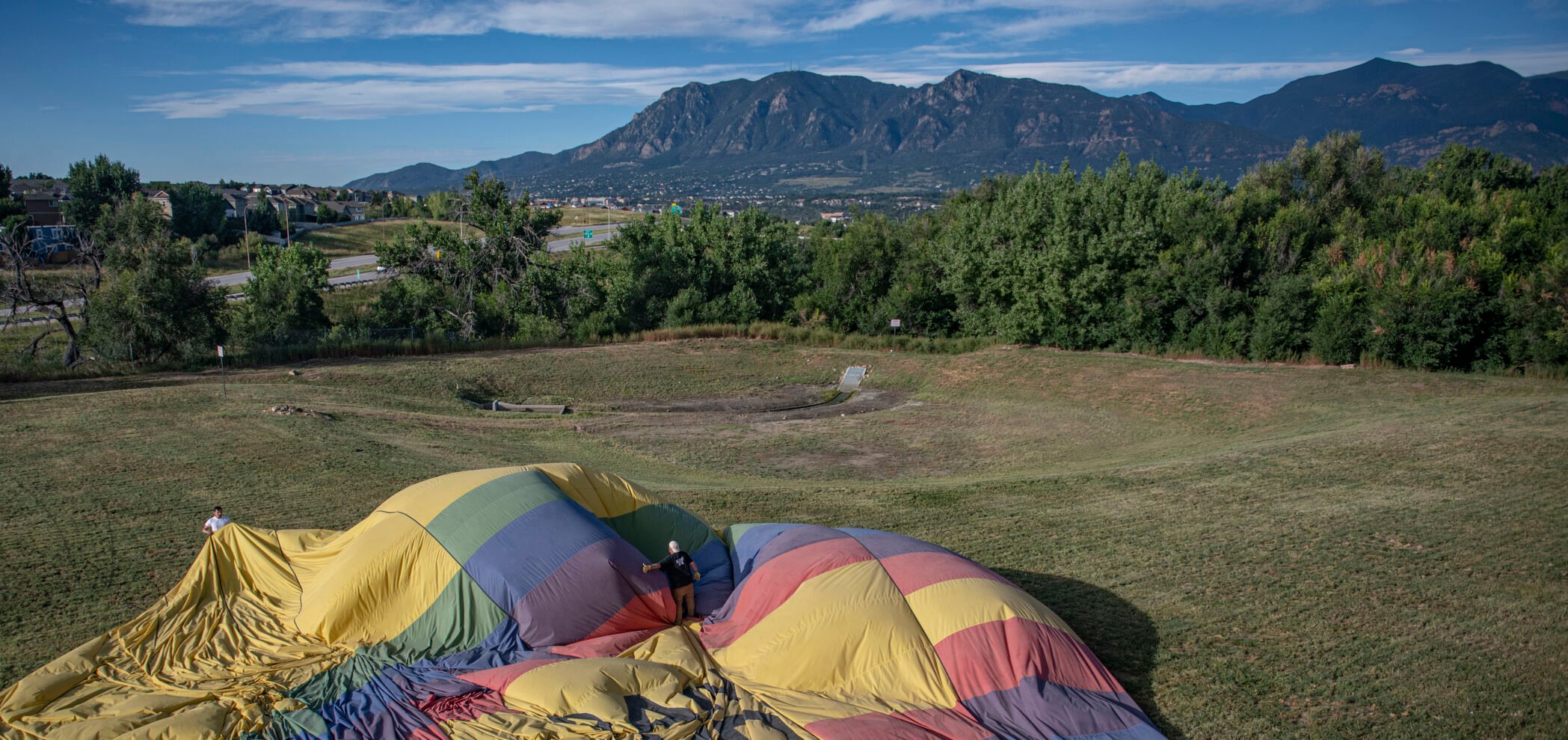 A Rainbow Ryders’ balloon is packed back up after landing just off of Fountain Ave during the Labor Day Lift Off in Colorado Springs on Saturday, September 2, 2023. (Gabi Broekema, The Gazette) (Gabi Broekema)