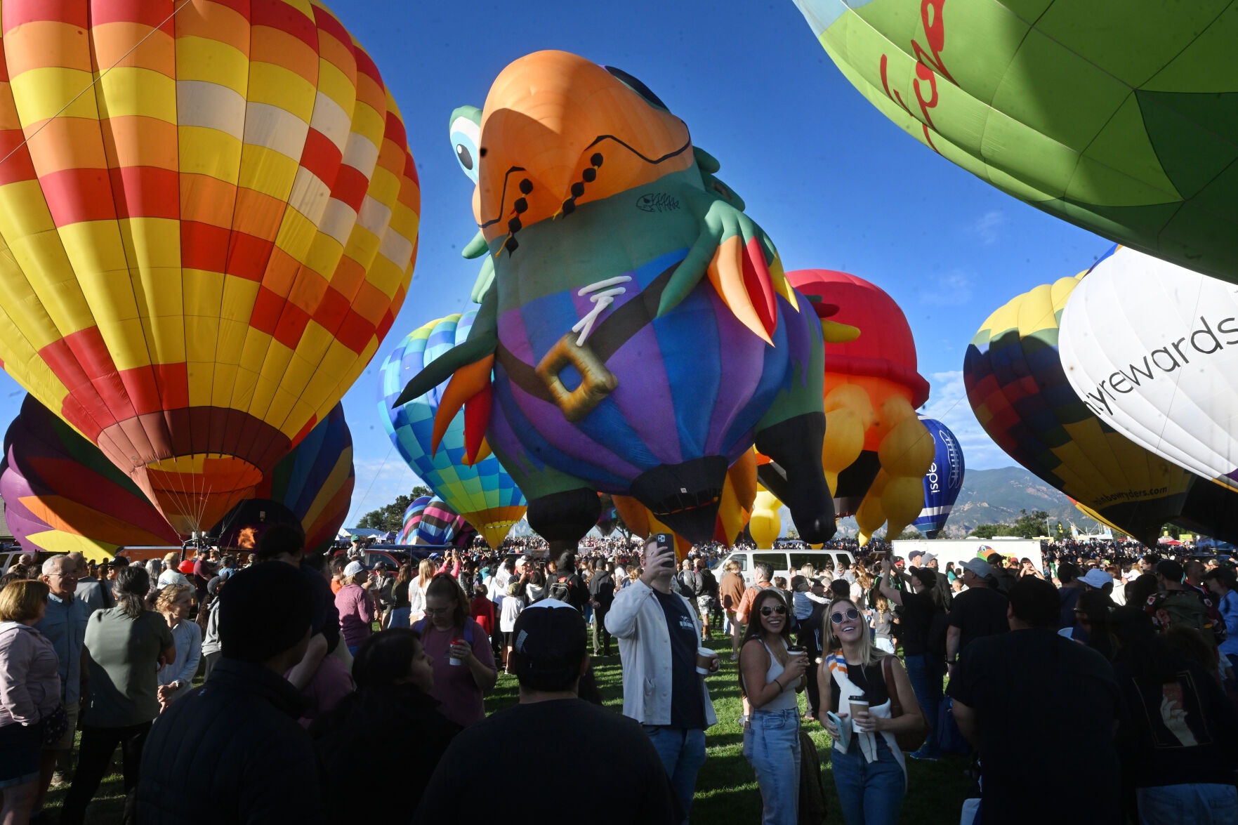 Peg Leg Pete the Pirate Parrot balloon looms over the crowd. The parrot balloon was one of the new kids on the block for this year’s Colorado Springs Labor Day Lift Off. The balloons didn’t lift off on Sunday morning, because of winds at higher altitudes, but most still participated with a stationary inflation to please the thousands on Sunday, Sept. 3, 2023. (Jerilee Bennett, The Gazette)