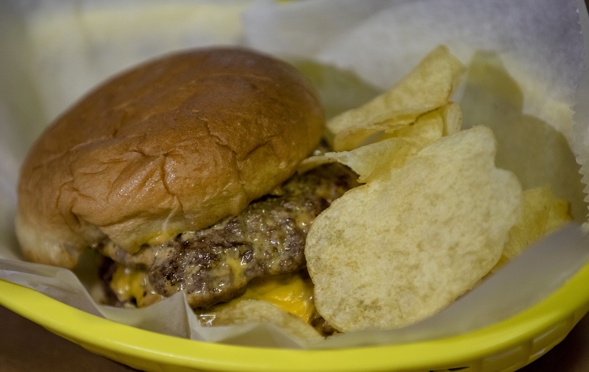 Double cheeseburger served at Bud’s Bar in Sedalia. Don’t ask for fries, but you can get a bag of chips with your burger. (Chancey Bush/The Gazette)