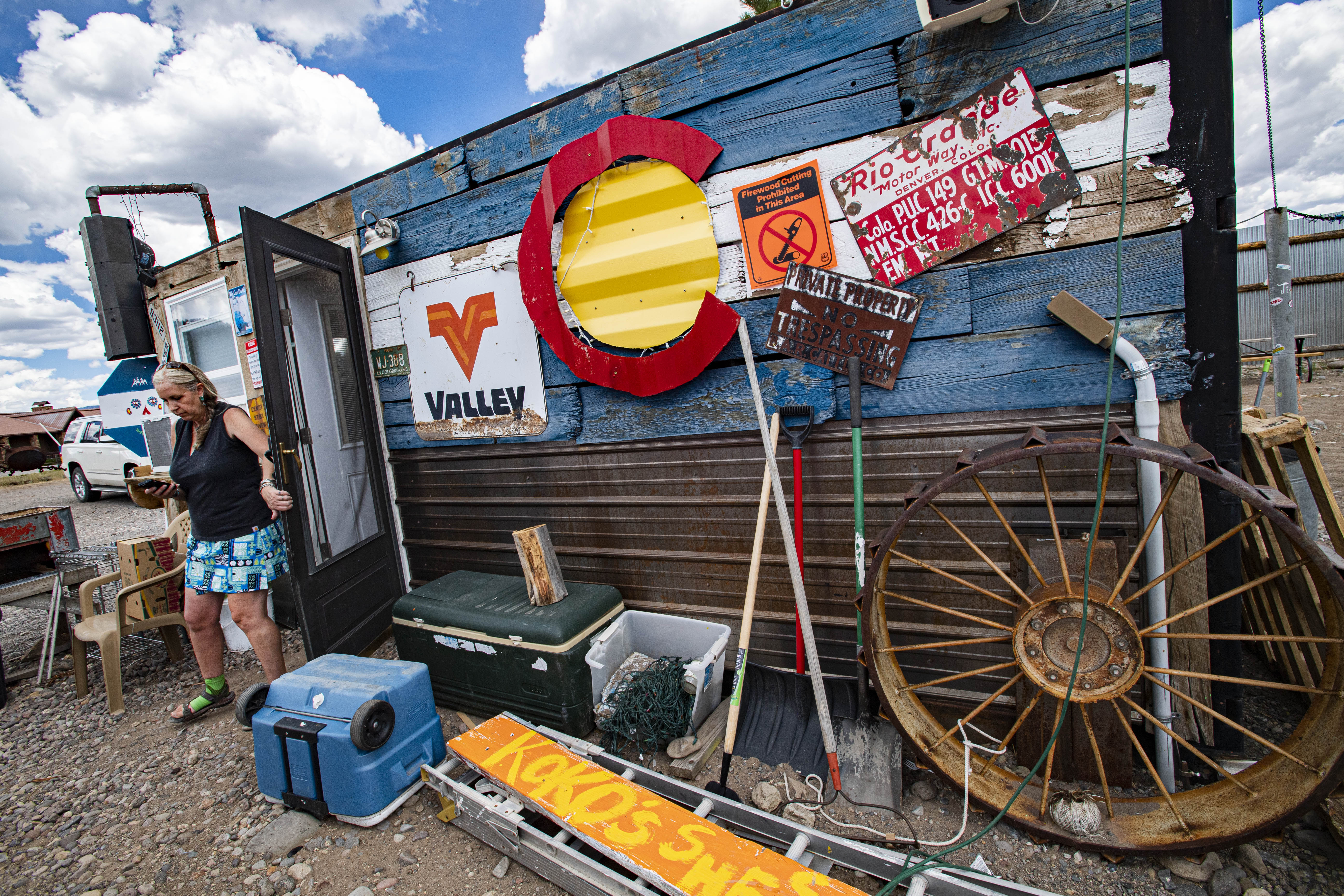 Rachel Davie leaves her breakfast building as she wraps up her day at Rachel’s Keep On Keepin’ On & Coffee in South Fork. (CHRISTIAN MURDOCK, THE denver GAZETTE)
