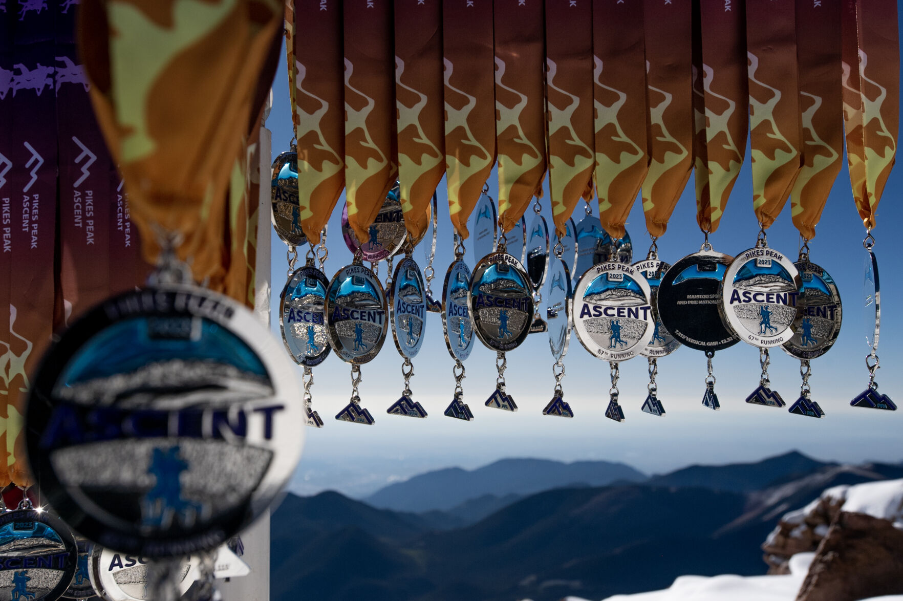 Medals for competitors hang at the Pikes Peak Ascent on Saturday, Sept. 16, 2023. (Parker Seibold, The Gazette) (Parker Seibold)