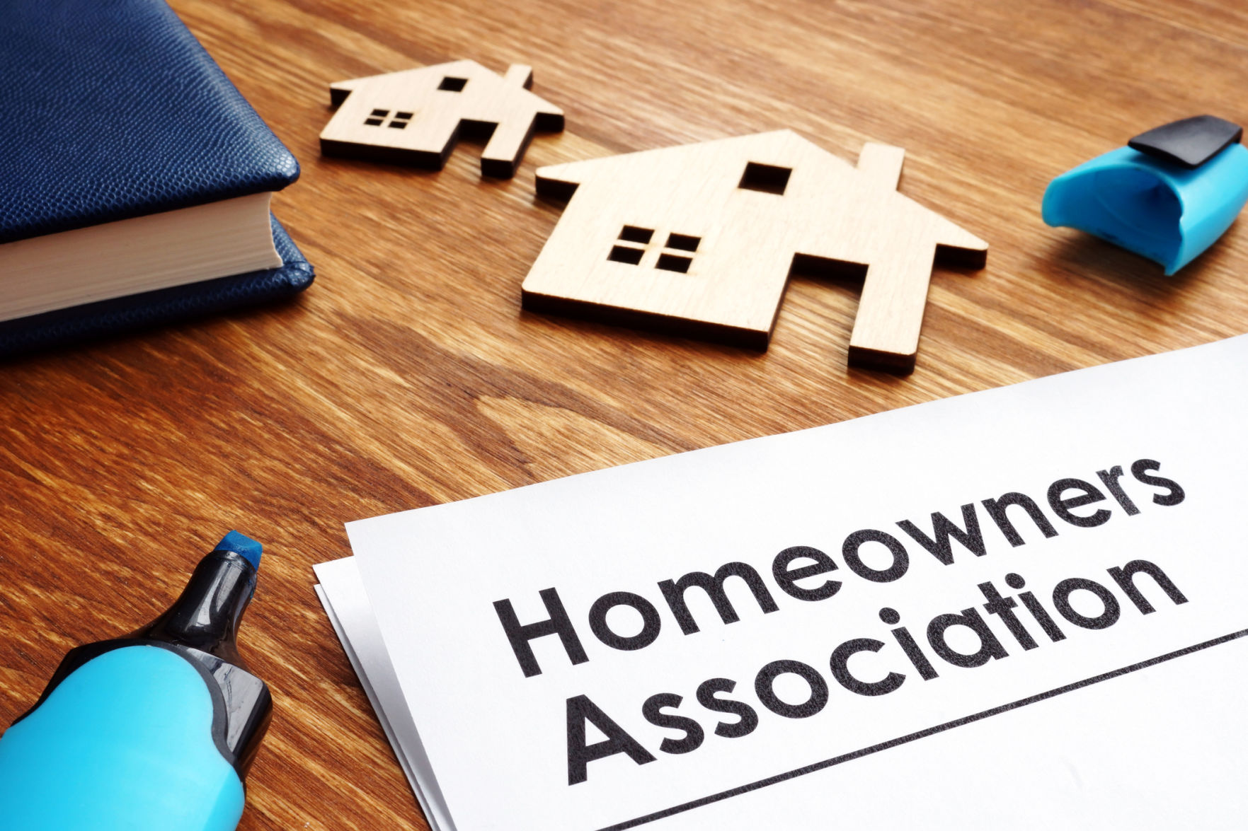 Documents about Homeowners Association HOA on a desk. (copy) (copy) (GETTY IMAGES)