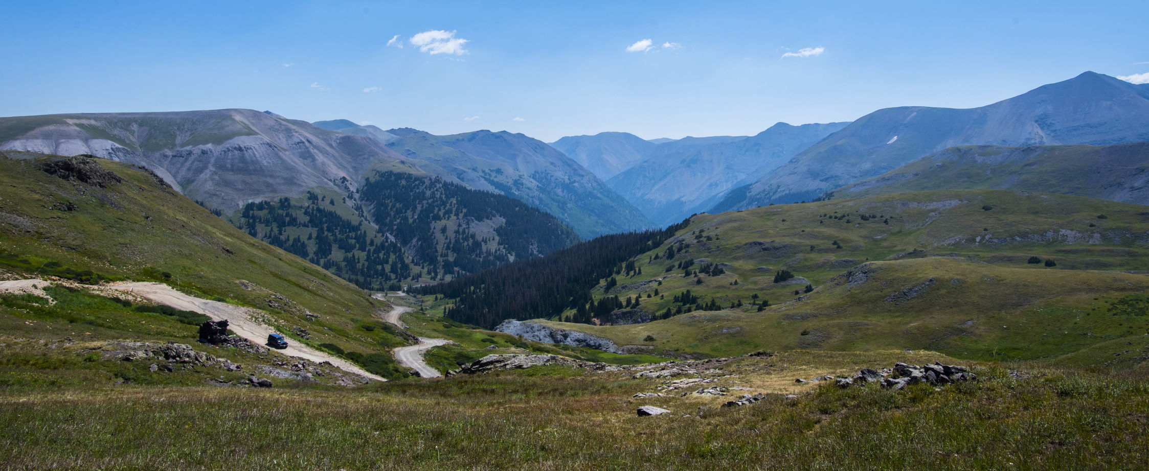 A Jeep descends Engineer Pass east of the 12,800-foot summit on the historic Alpine Loop in August. A four-wheel drive vehicle with high ground clearance is required to reach the summit of Engineer Pass, which begins outside Ouray and runs east 30.9 miles — 27.2 miles of it unpaved — to Lake City. The 63-mile Alpine Loop runs through the San Juan Mountains of southwestern Colorado. (Engineer Pass, Christian Murdock)