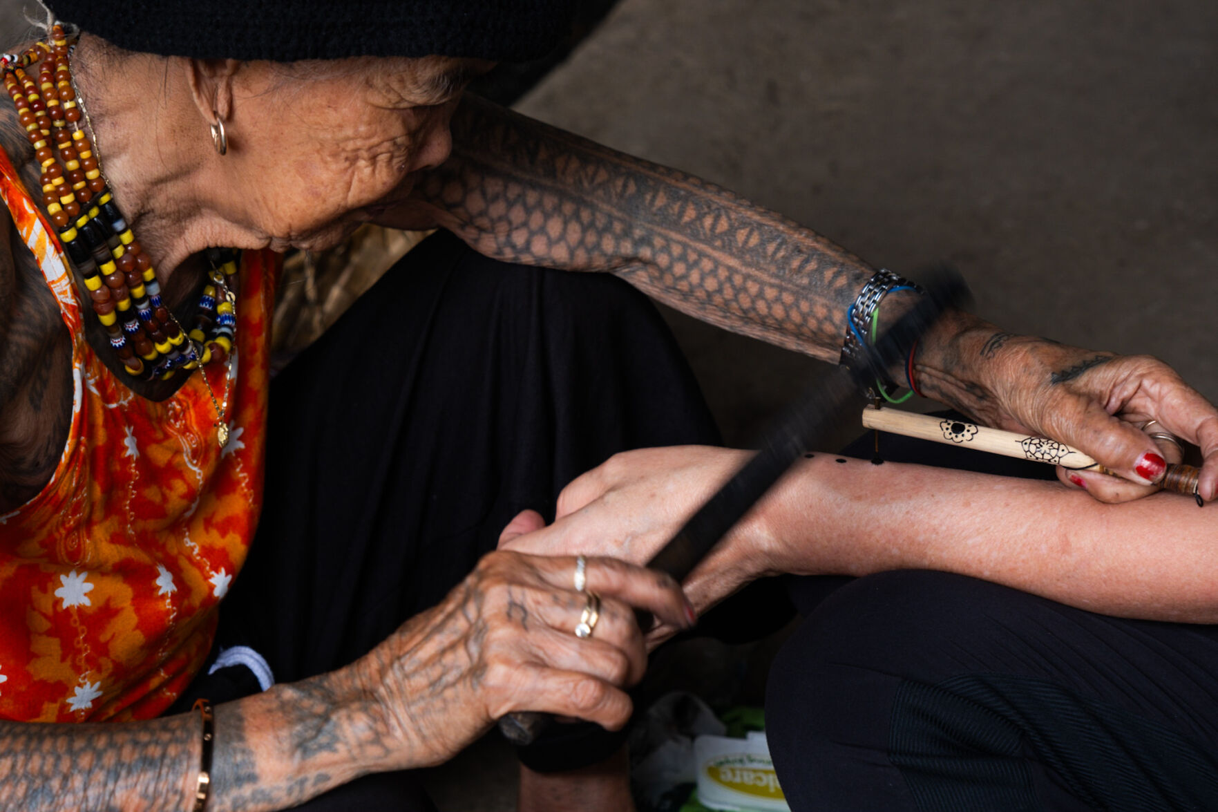 Whang-Od makes tattoos by tapping on a thorn dipped in ink. (photos by Aria Brauchli, Special to The Gazette)
