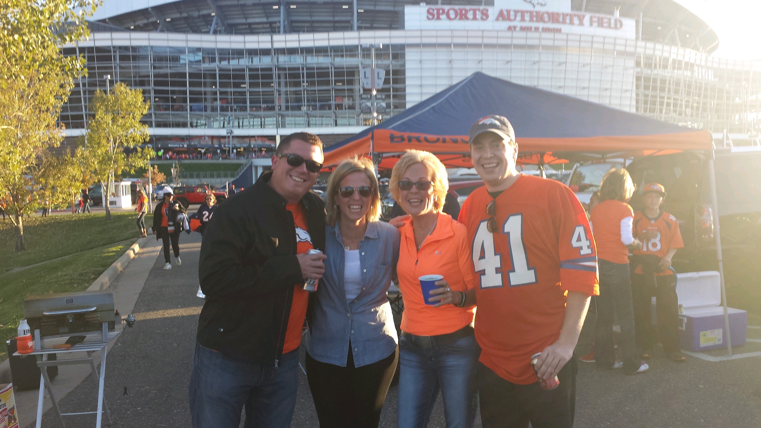 Members of the family of late Denver Broncos running back Rob Lytle at a ceremony on Oct. 19, 2014, when his ashes were spread in a parking lot at Empower Field at Mile High, where Mile High Stadium used to stand. Family members placed the ashes of Lytle, who died in 2010, on the site of a controversial non-fumble by the running back in the 1977 AFC championship game against the Oakland Raiders. Right to left: Lytle’s son, Kelly Lytle; Lytle’s wife, Tracy Lytle; daughter, Erin Lytle Tober; Erin's husband, Dan Tober. (Courtesy of Kelly Lytle) (Courtesy Kelly Lytle)