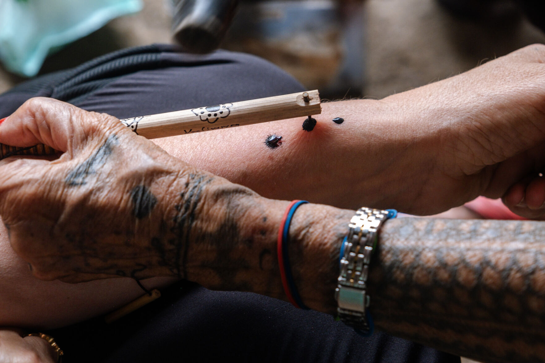 Whang-Od’s signature is three dots, tapped into the skin. Photo by Aria Brauchli, Special to The Gazette (Aria Brauchli, Special to The Gazette)