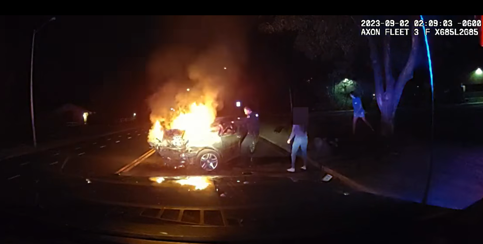 Longmont officer pulls man from burning car