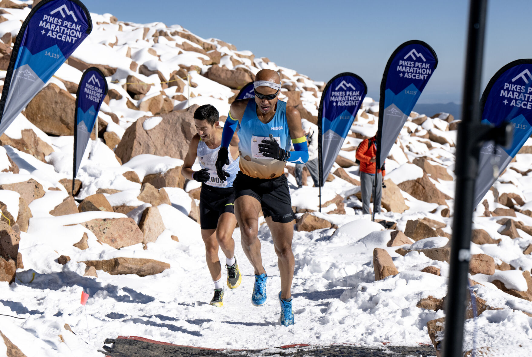 Roberto Delorenzi, left, and Joseph Gray race to the finish line of the Pikes Peak Ascent on Saturday, Sept. 16, 2023. (Parker Seibold, The Gazette) (Parker Seibold)