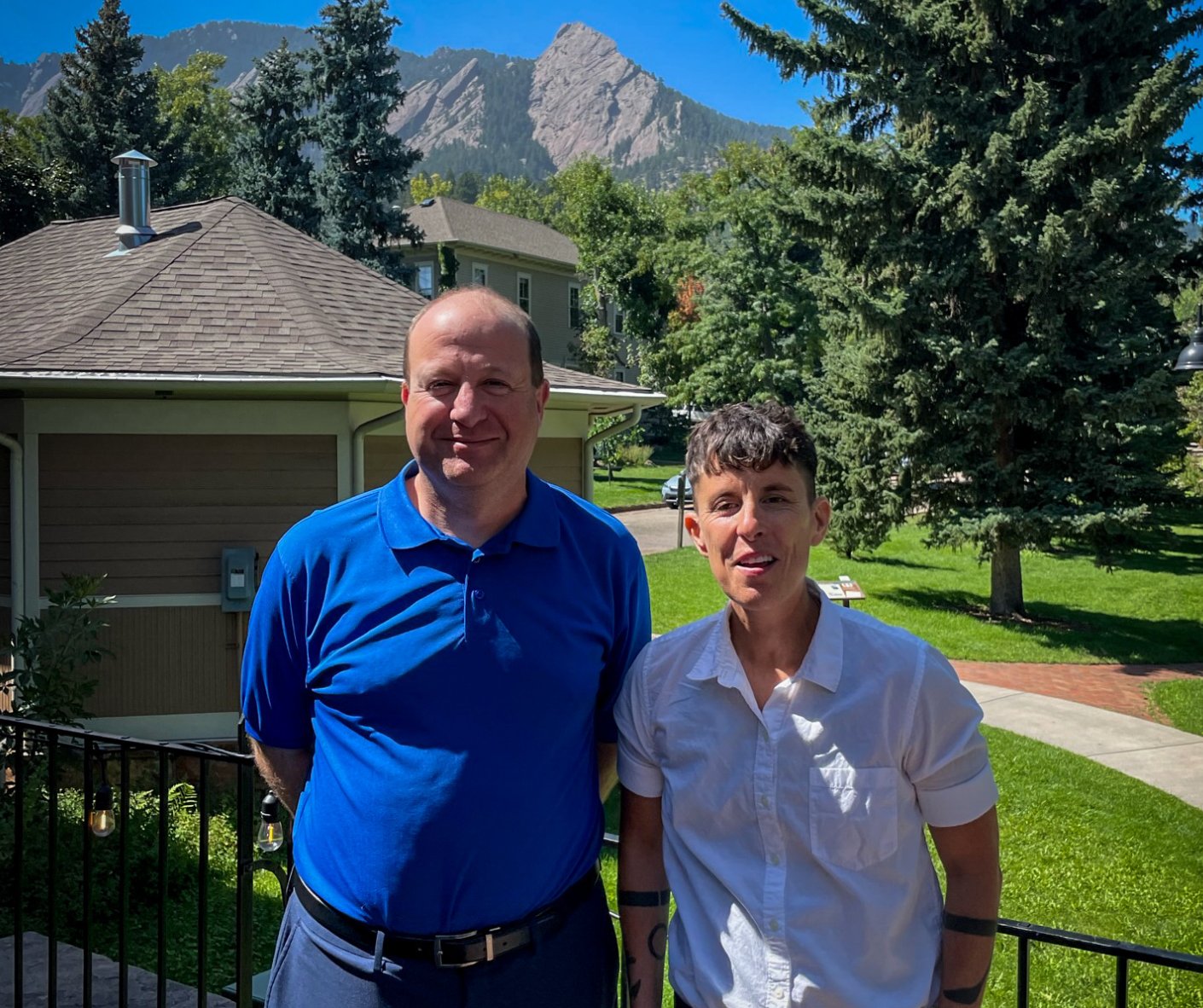 Gov. Jared Polis with new Colorado Poet Laureate Andrea Gibson, who was introduced on Sept. 6 at the Colorado Chautauqua in Boulder. (Courtesy office of Jared Polis)