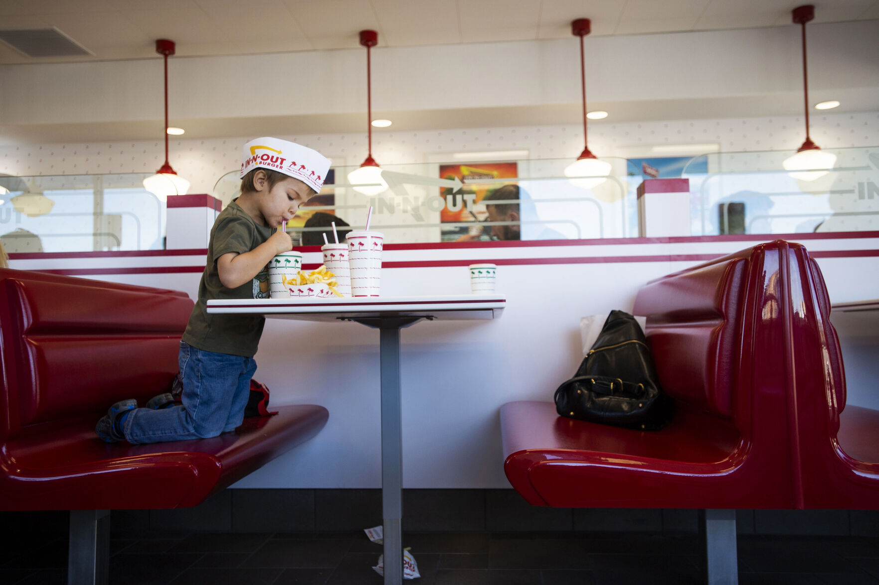 Greyson Valdez, 3, enjoys a strawberry shake during opening day of the second In-N-Out Burger in Colorado Springs located at 2895 New Center Point, east of Powers Boulevard and Constitution Avenue on the Springs' east side, on Nov. 5, 2021. (Chancey Bush / The Gazette) (Chancey Bush/ The Gazette)