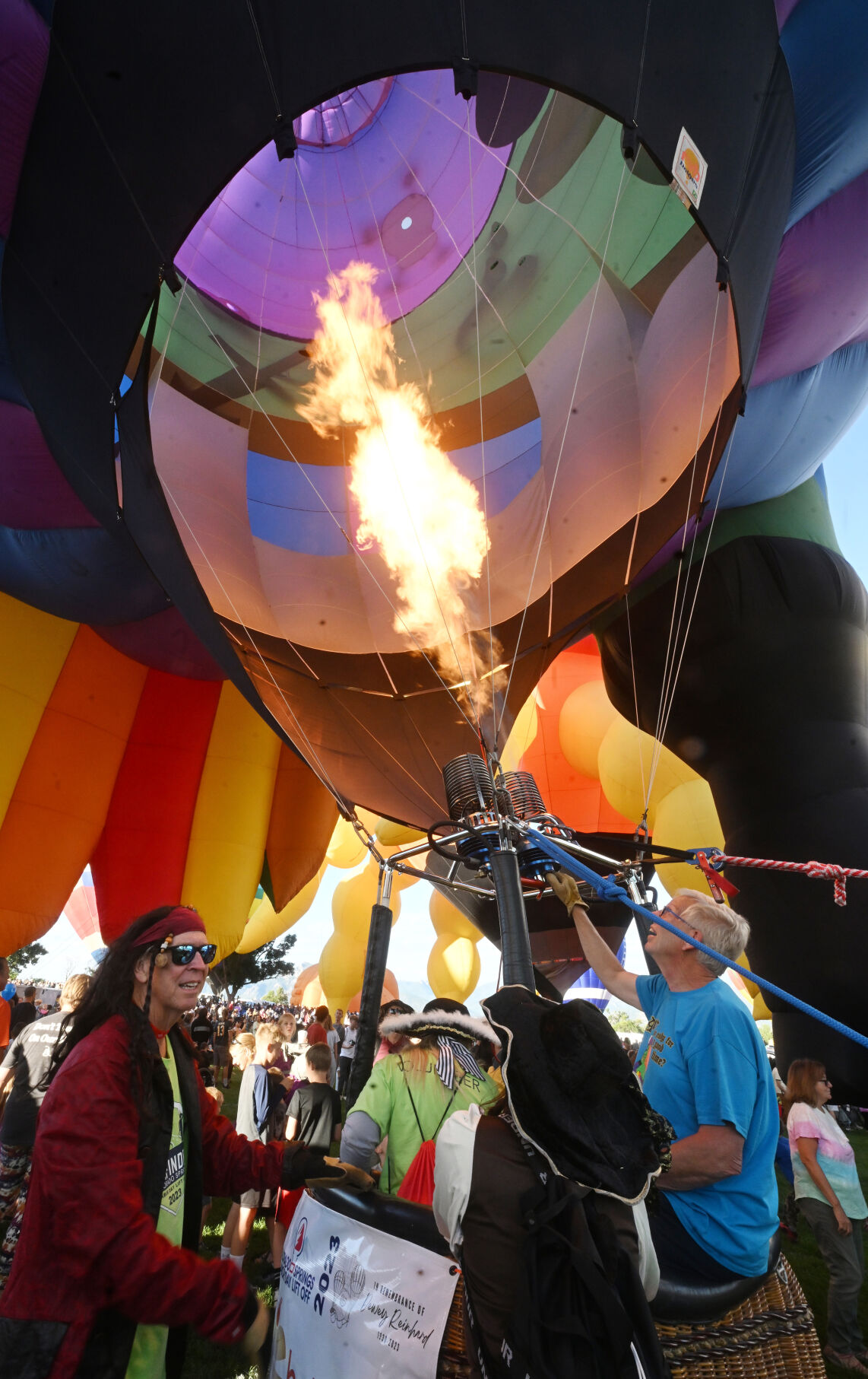 Pilot Dave Reineke uses the burners to finish inflating the Peg Leg Pete the Pirate Parrot balloon. The parrot balloon was one of the new kids on the block for this year’s Colorado Springs Labor Day Lift Off. The balloons didn’t lift off on Sunday morning, because of winds at higher altitudes, but most still participated with a stationary inflation to please the thousands on Sunday, Sept. 3, 2023. (Jerilee Bennett, The Gazette)
