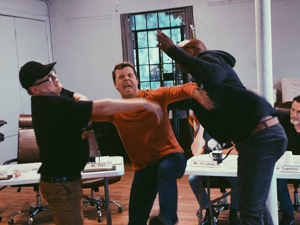 From left: Longtime Curious Theatre Company members (and friends) Brian Landis Folkins, Josh Robinson and Cajardo Lindsey reunite for the not-so-friendly comedy 'The Minutes,' the company's 2023-24 season opener. (Rehearsal photo courtesy Curious Theatre Comopany)