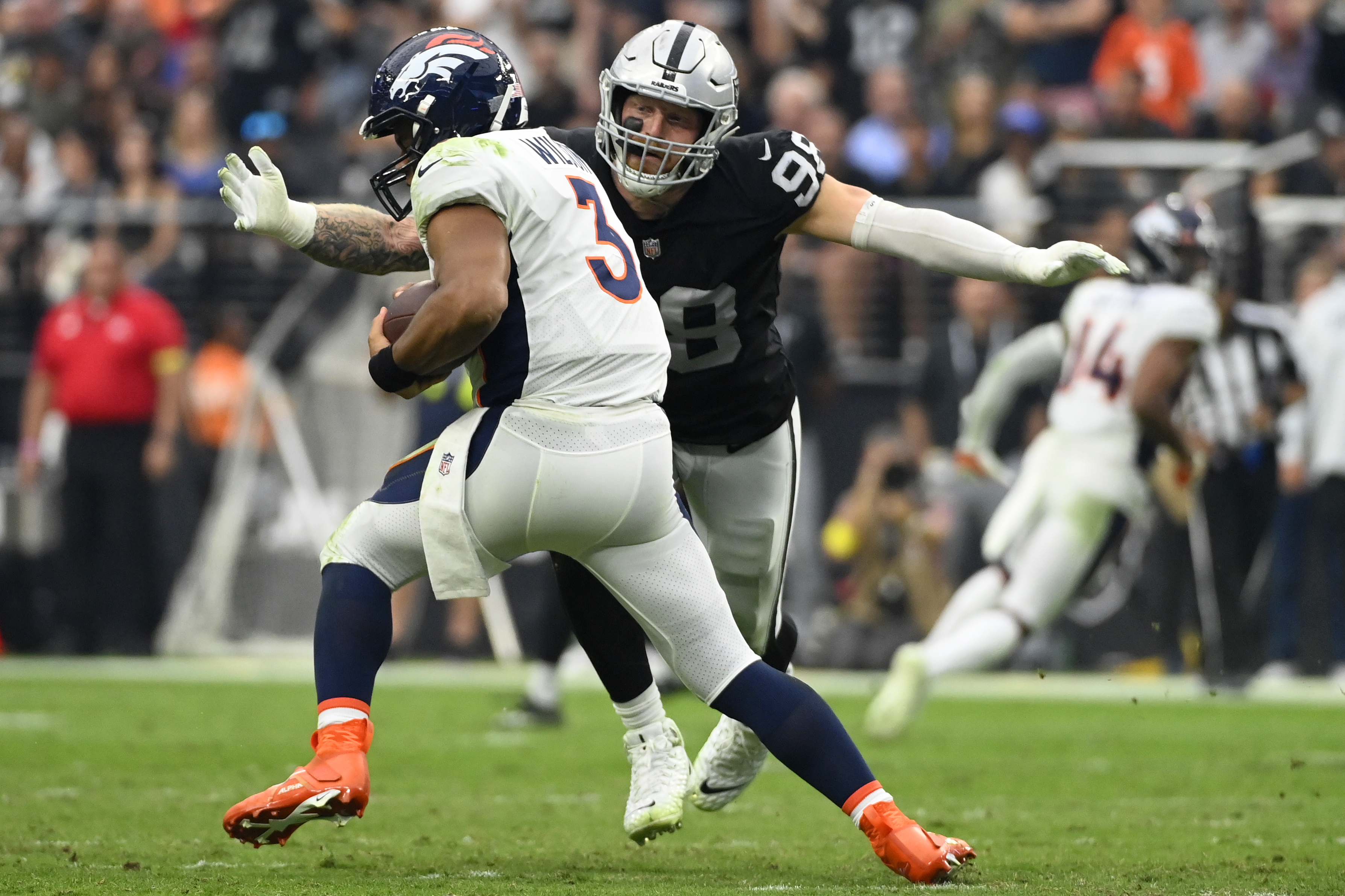 Denver Broncos quarterback Russell Wilson (3) is sacked by Las Vegas Raiders defensive end Maxx Crosby (98) during the second half of an NFL football game, Sunday, Oct. 2, 2022, in Las Vegas. (AP Photo/David Becker) (GeorgeStoiaBroncos beat writergeorge.stoia@gazette.comhttps://secure.gravatar.com/avatar/5b8854c53e77d2068c18c16523197323?d=mm&r=g)