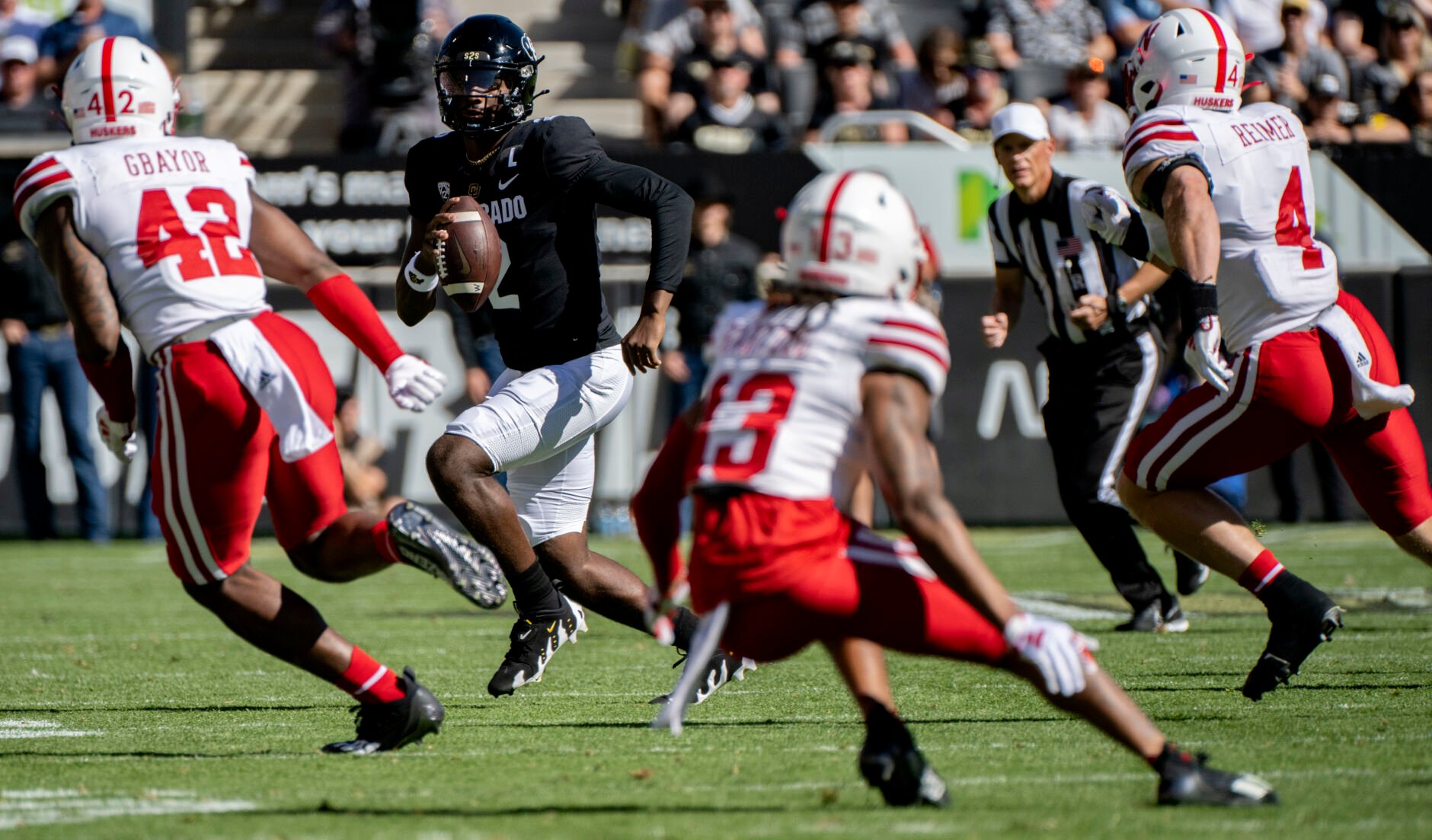 Colorado Buffaloes quarterback Shedeur Sanders (2) scrambles before throwing down field against the Nebraska defense during the first half Saturday, Sept. 9, 2023, at Folsom Field in Boulder, Colo. (The Gazette, Christian Murdock) (Christian Murdock/The Gazette)