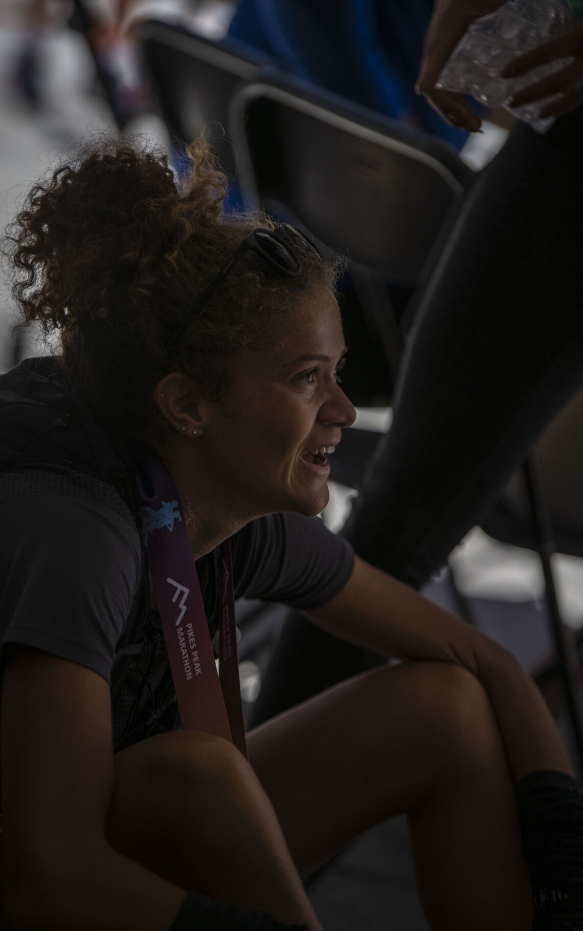 Pikes Peak Marathon’s 3rd placing woman overall smiles in the shade of the cooldown tent in Manitou Springs on Sunday, September 17, 2023. (Gabi Broekema)